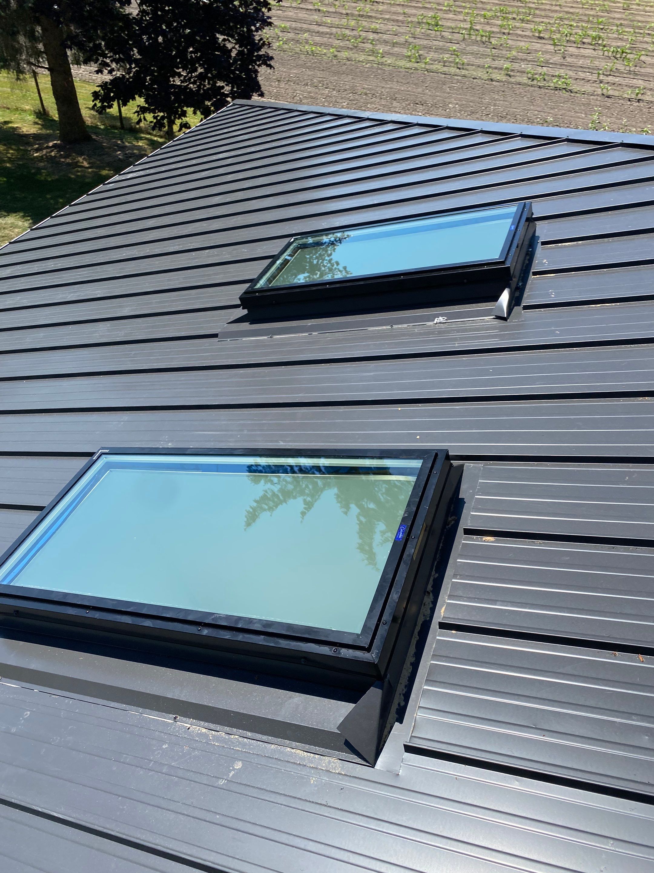 Residential Roofing Installation using 12" Prolok metal  by Top Notch Roofing Inc