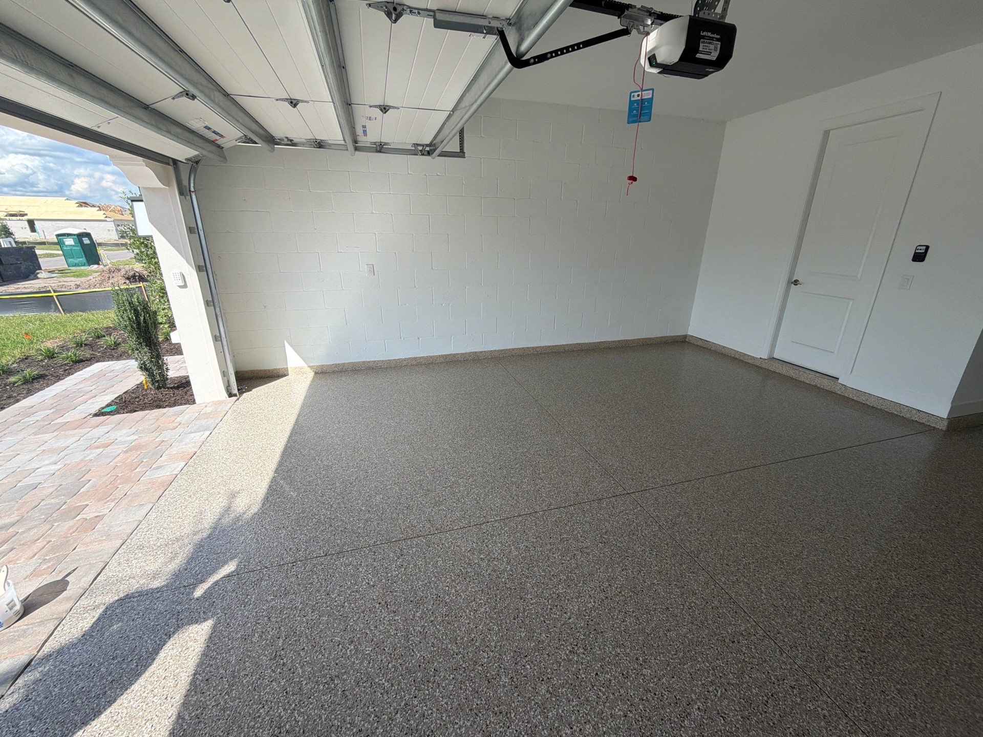 Custom Epoxy Floor Coating for Wesley Chapel Garage by Performance Floors & Coating