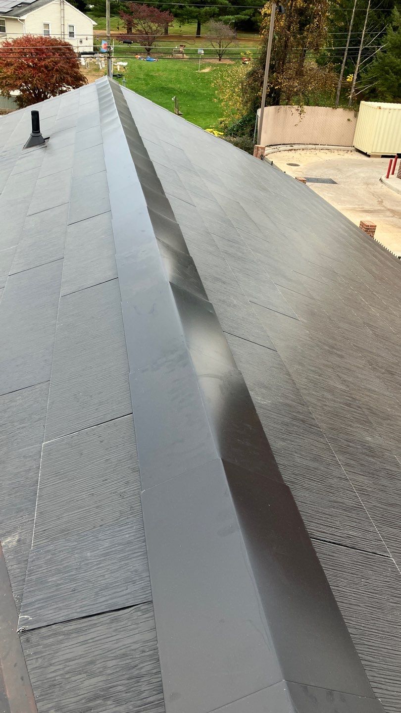 Tesla Solar Roof on a Commercial Building by American Home Contractors