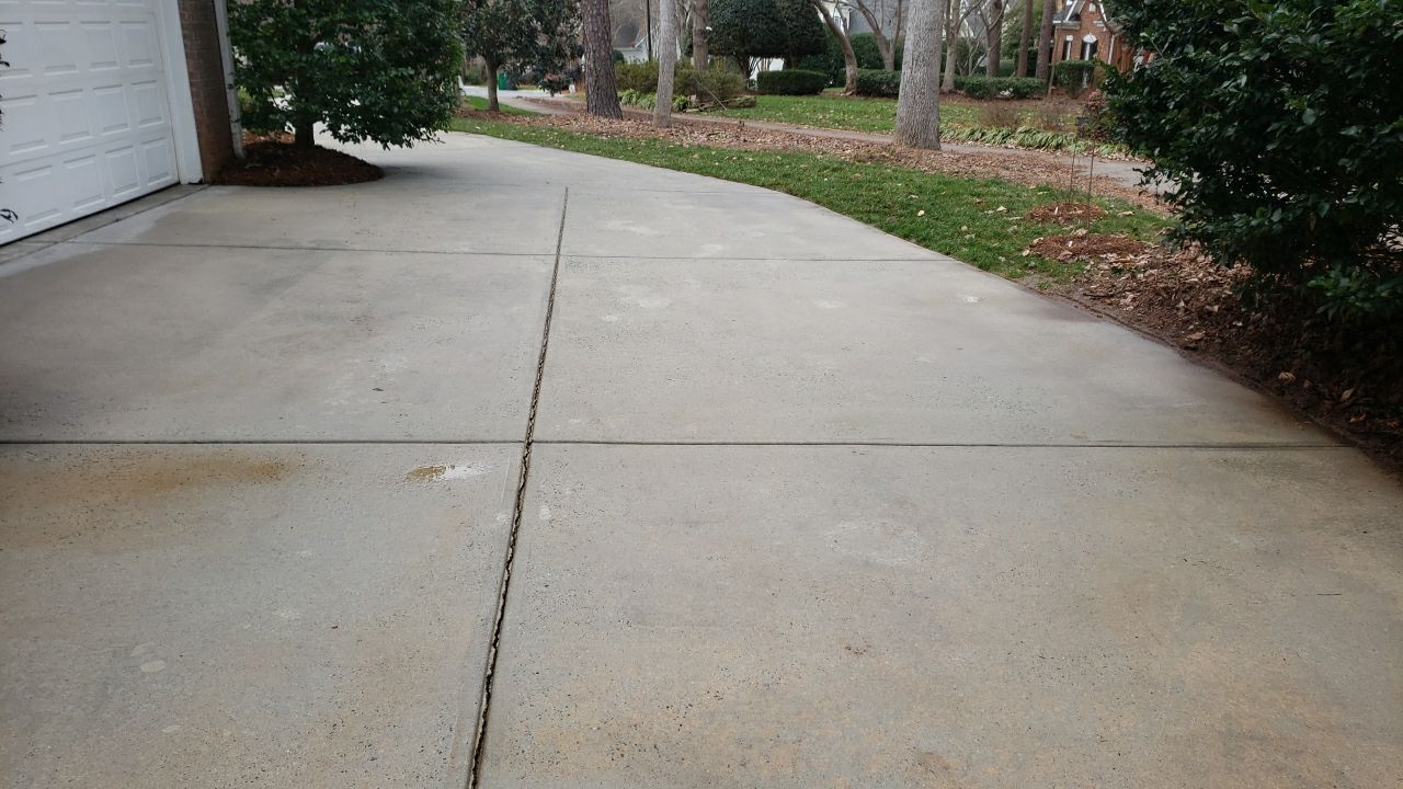 Driveway Clean using cleaner by Power Wash Masters LLC