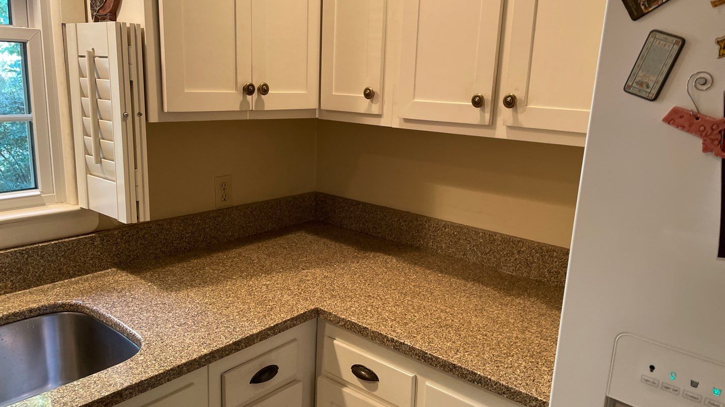 New Backsplash to Compliment the Countertops by Footprints Floors of Coastal Carolina