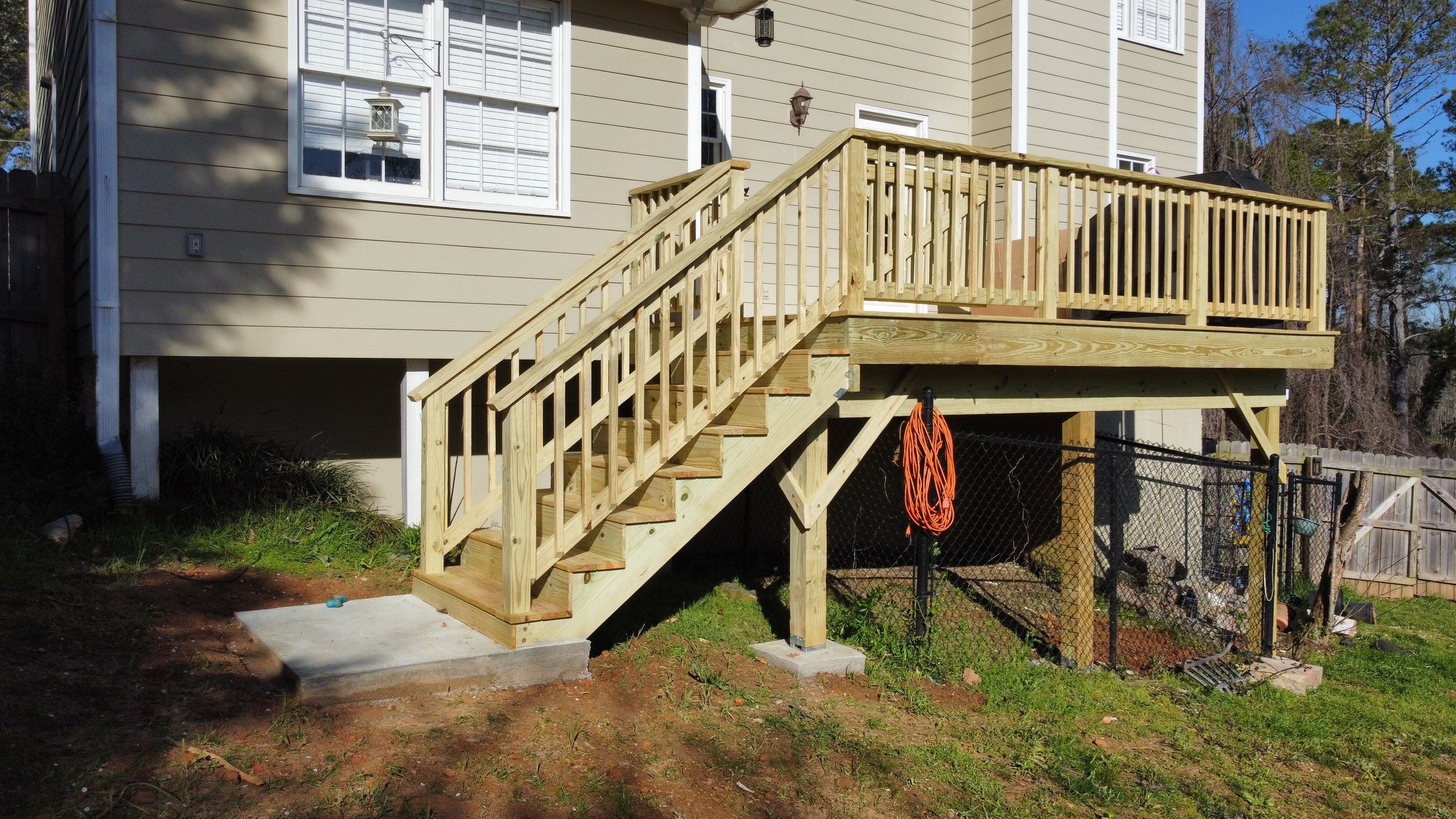 Elevated Pressure-Treated Wood Deck Replacement in Marietta by Swift Home Renovations