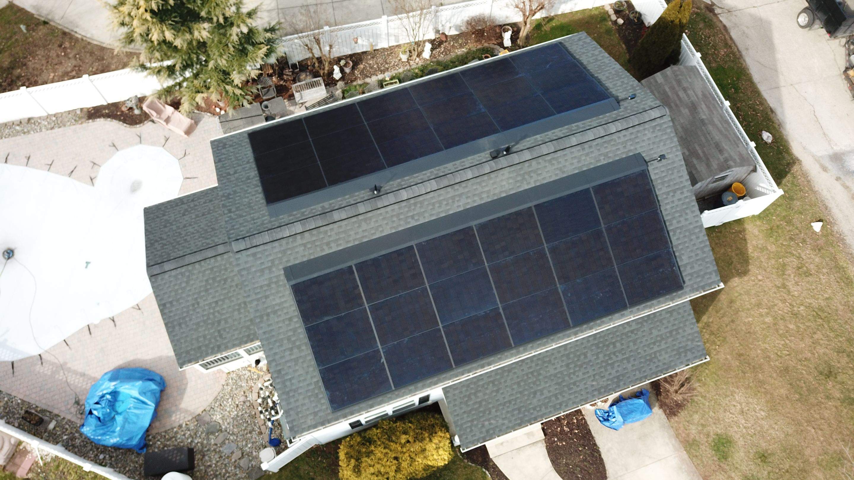Roof Replacement with GAF Decotech integrated solar panels by American Home Contractors
