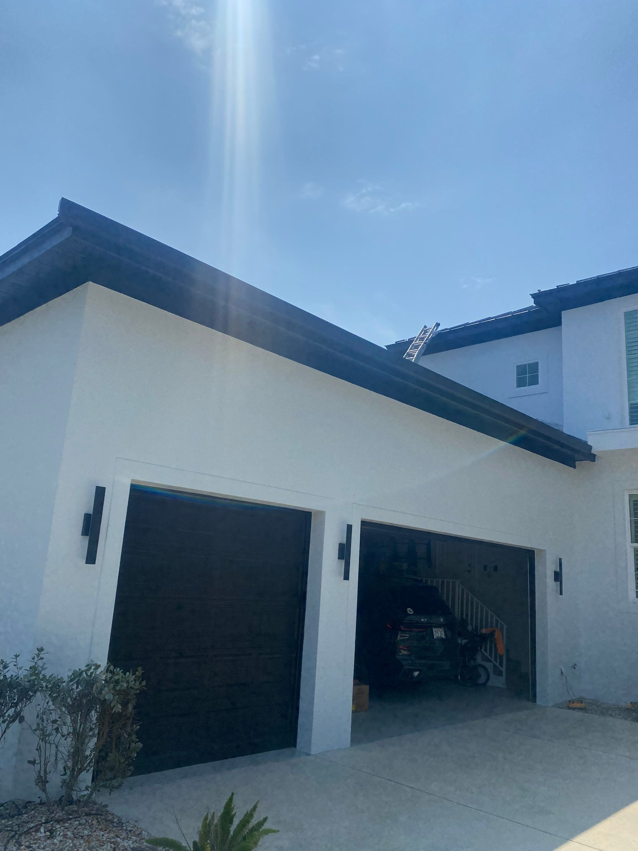Soffit and Fascia Installation and black seamless gutters in Sarasota FL by Gutter Professors