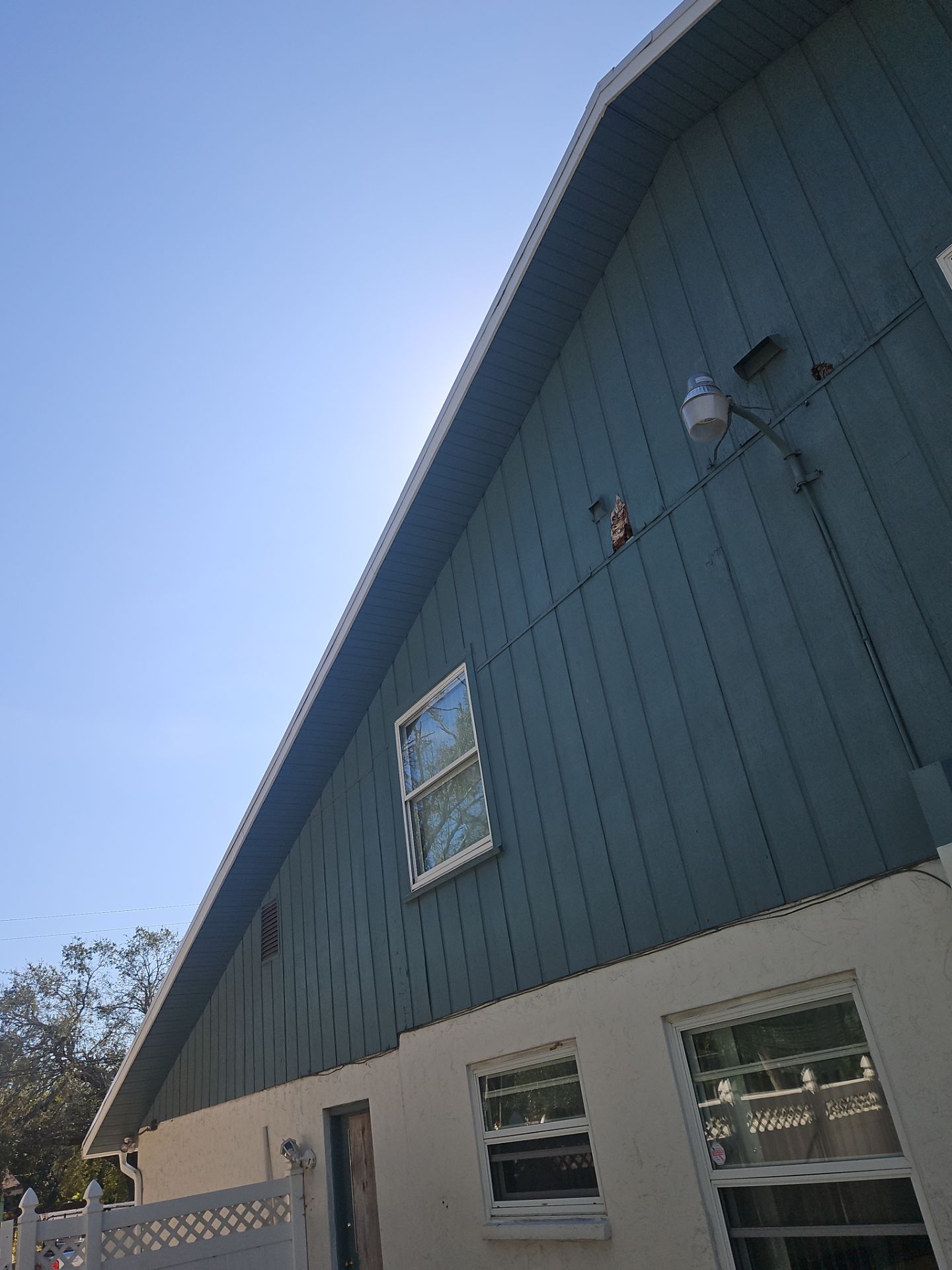 K-Style Seamless Gutter Installation using White Seamless Gutters in Sarasota FL by Gutter Professors