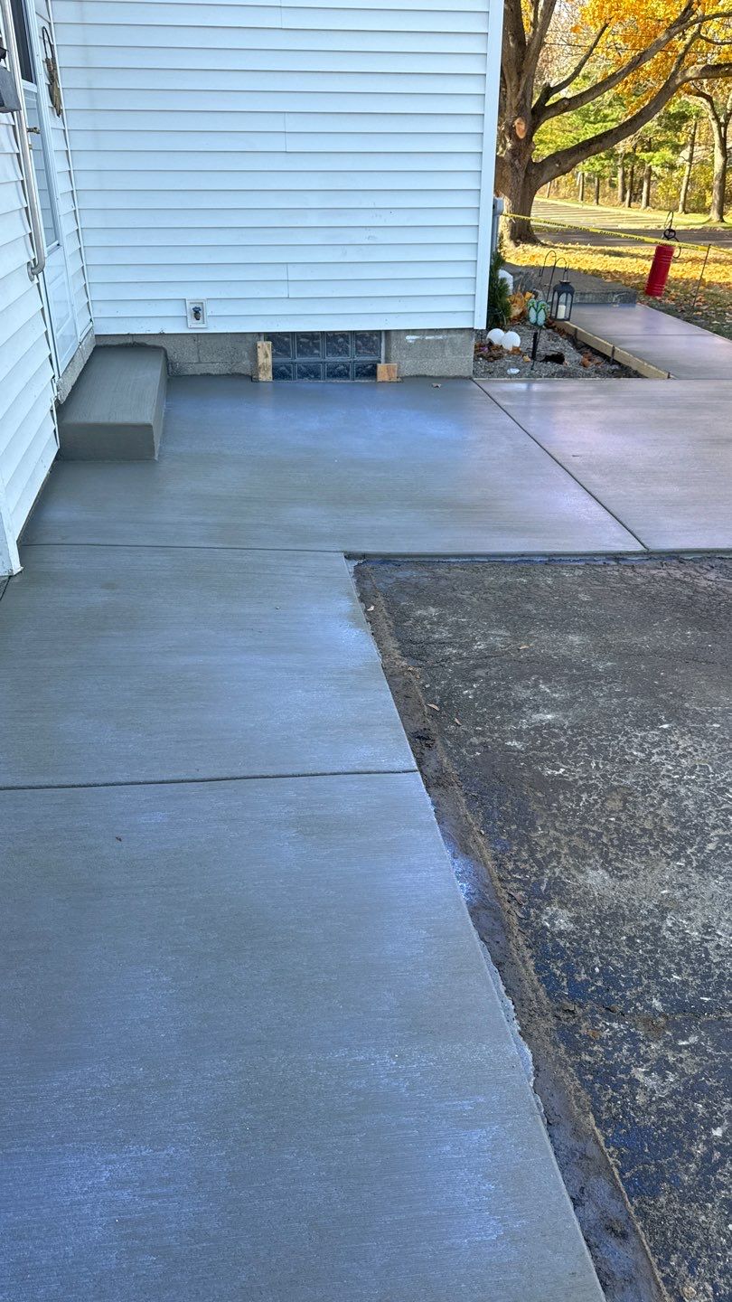 Broom finished concrete patio  by NG Masonry & Construction LLC