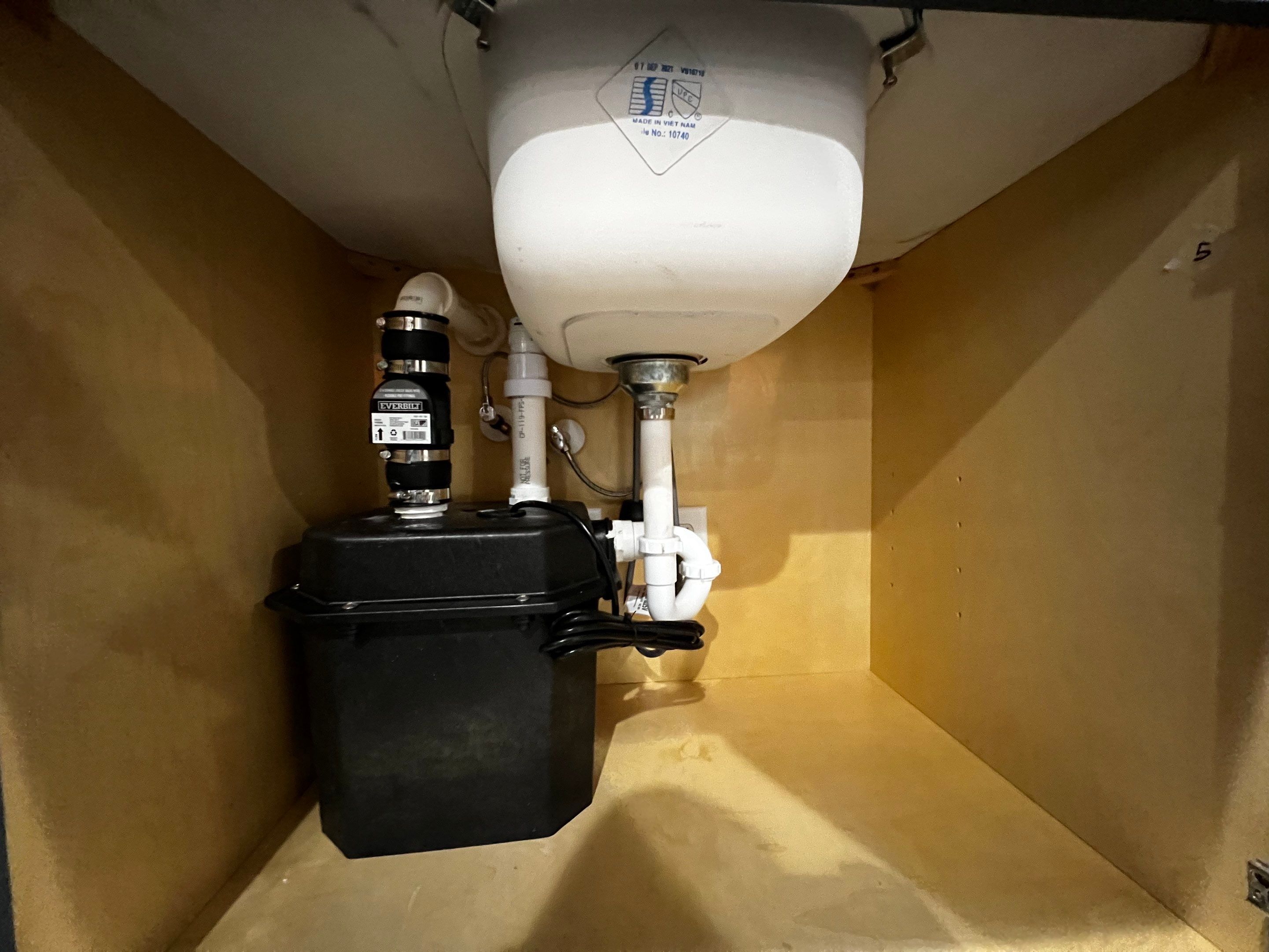 Modern Basement Remodeling in Woodstock with Custom Live-Edge Bar by Swift Home Renovations