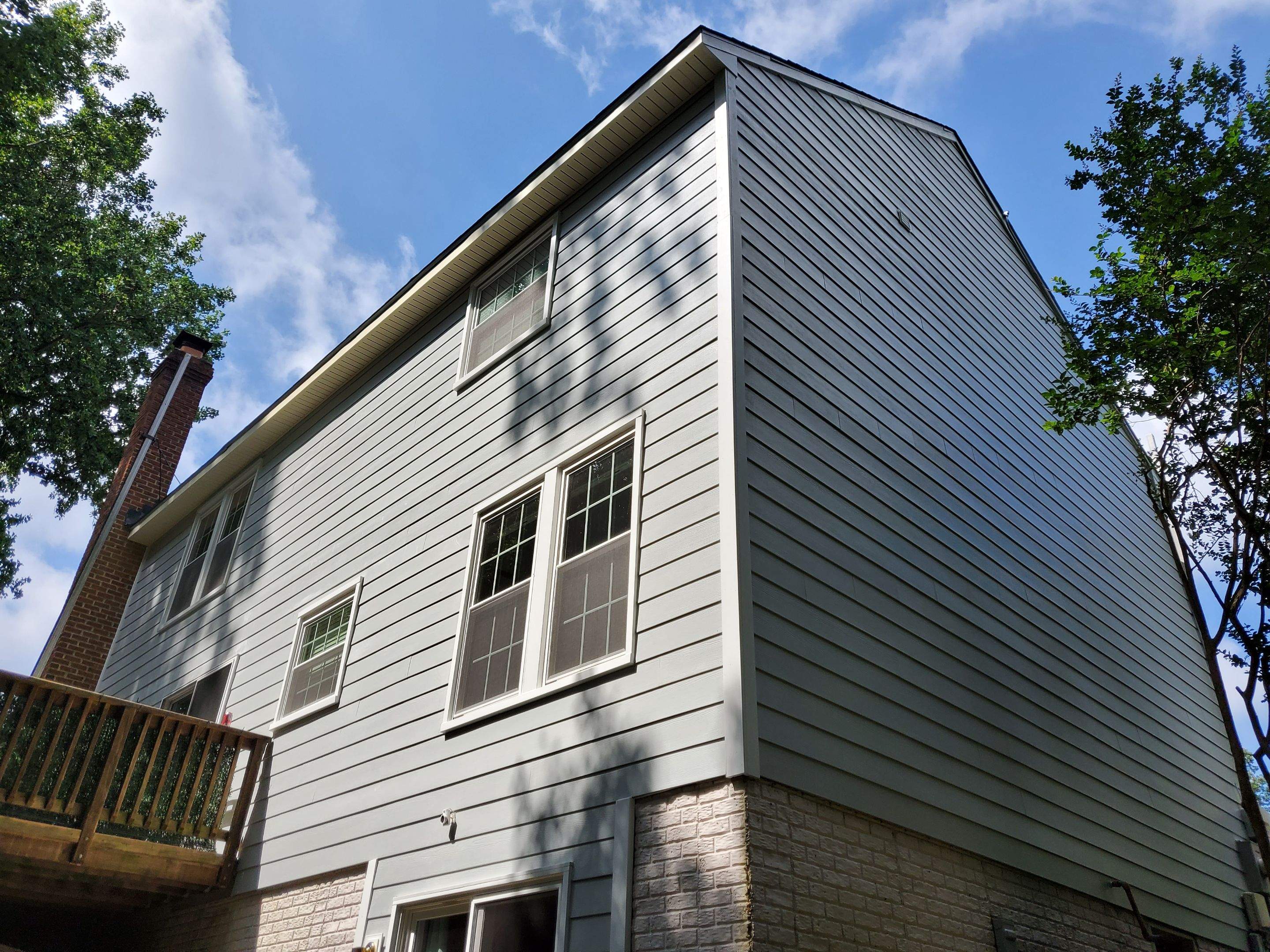Exterior Home Makeover using GAF Timberline HDZ, GAF Decotech, and James Hardie Siding by American Home Contractors