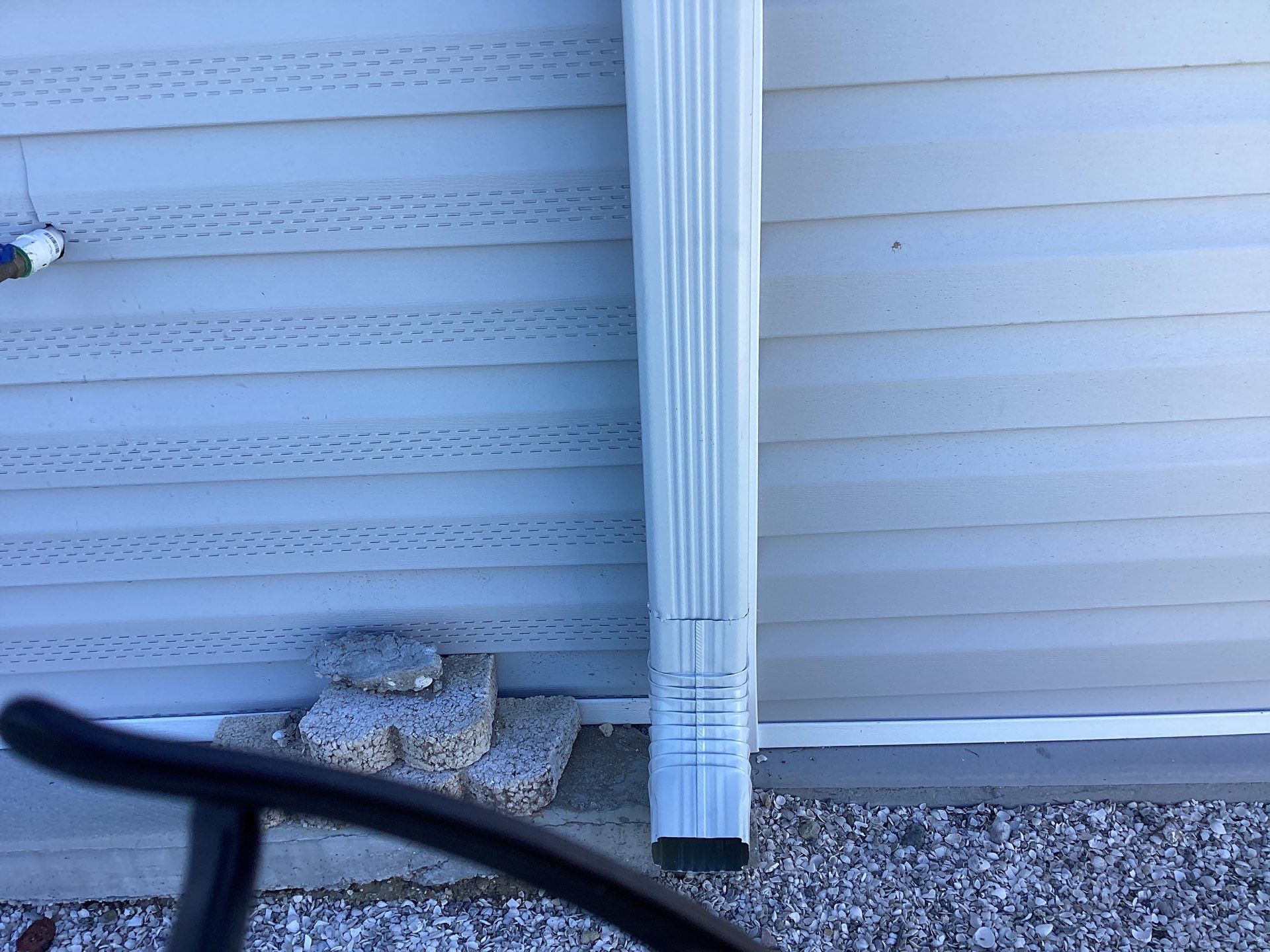 White Downspouts Installation in St. James City by Gutter Professors