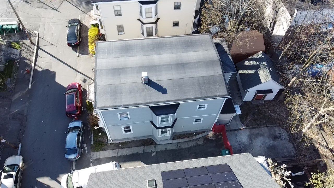 Residential Rubber Roofing -2 Story Home  by Delarosa Construction & Design