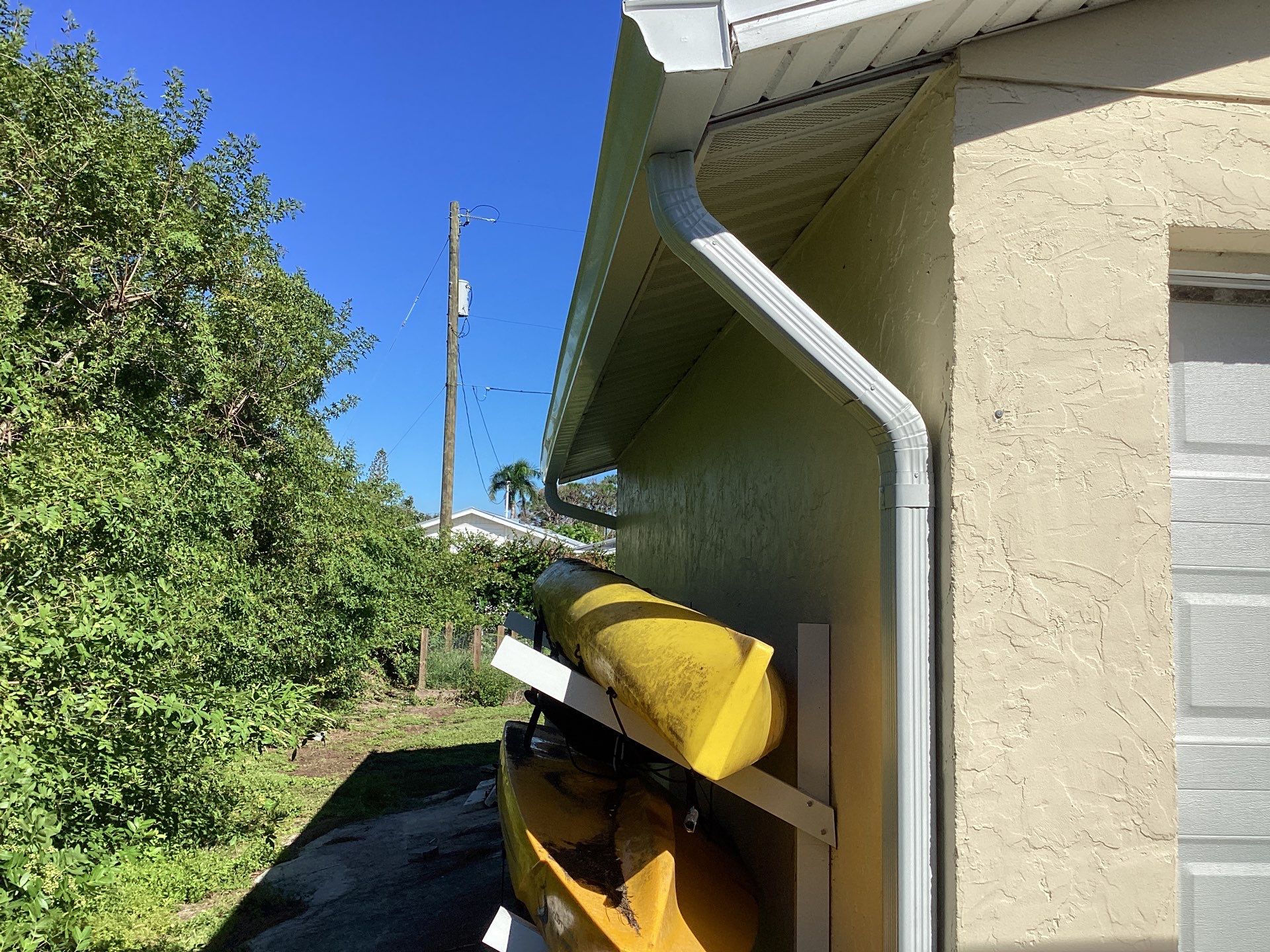 3x4 Downspouts and Seamless Gutters for Coastal Homes in St James City FL by Gutter Professors
