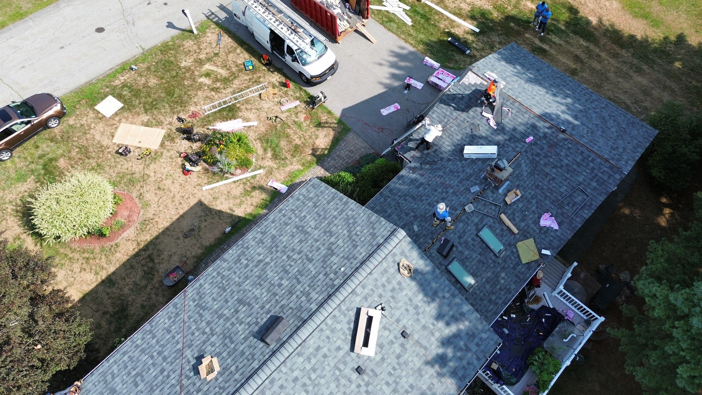 Complete Roof Replacement with Chimney Flashing, Gutter Guard System, and Vinyl Siding Repairs by Mighty Dog Roofing of Greater Middlesex County