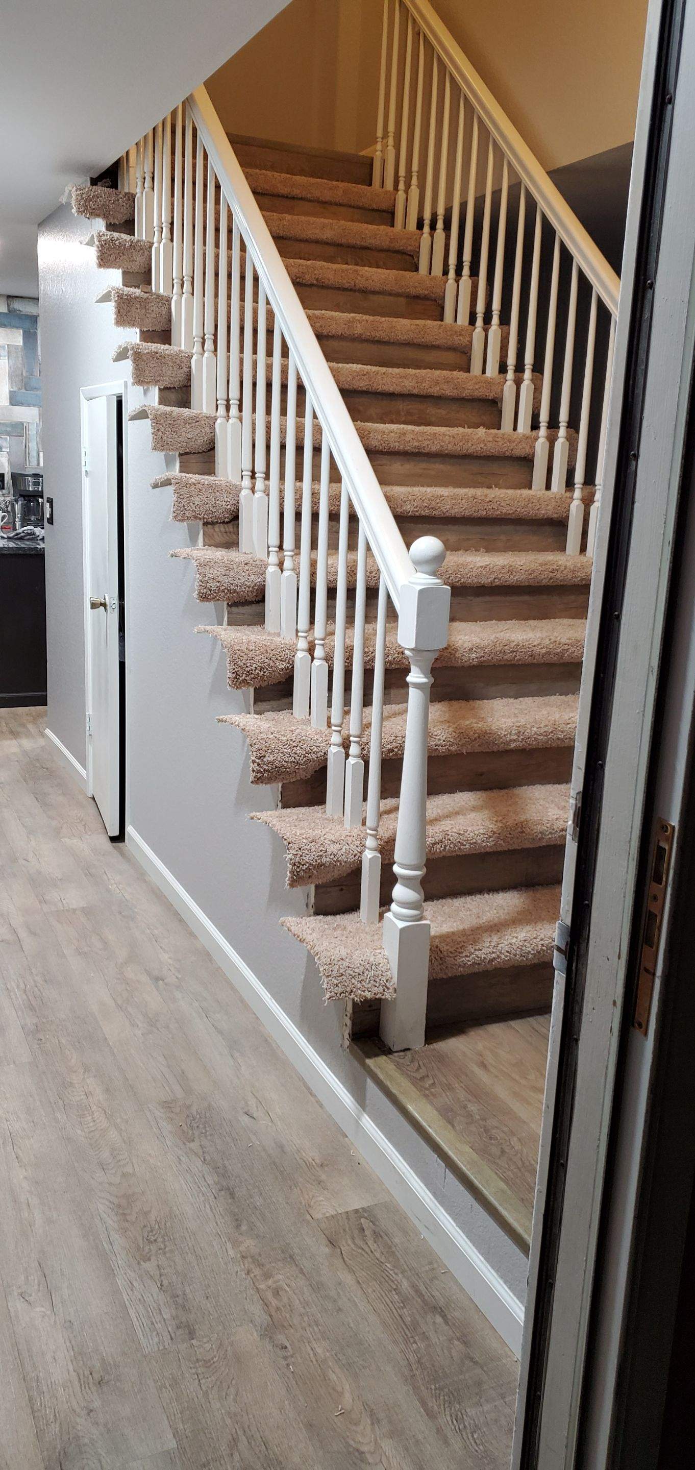 Carpet Install on Stairs with Spindles by Ardent Carpet Restore LLC