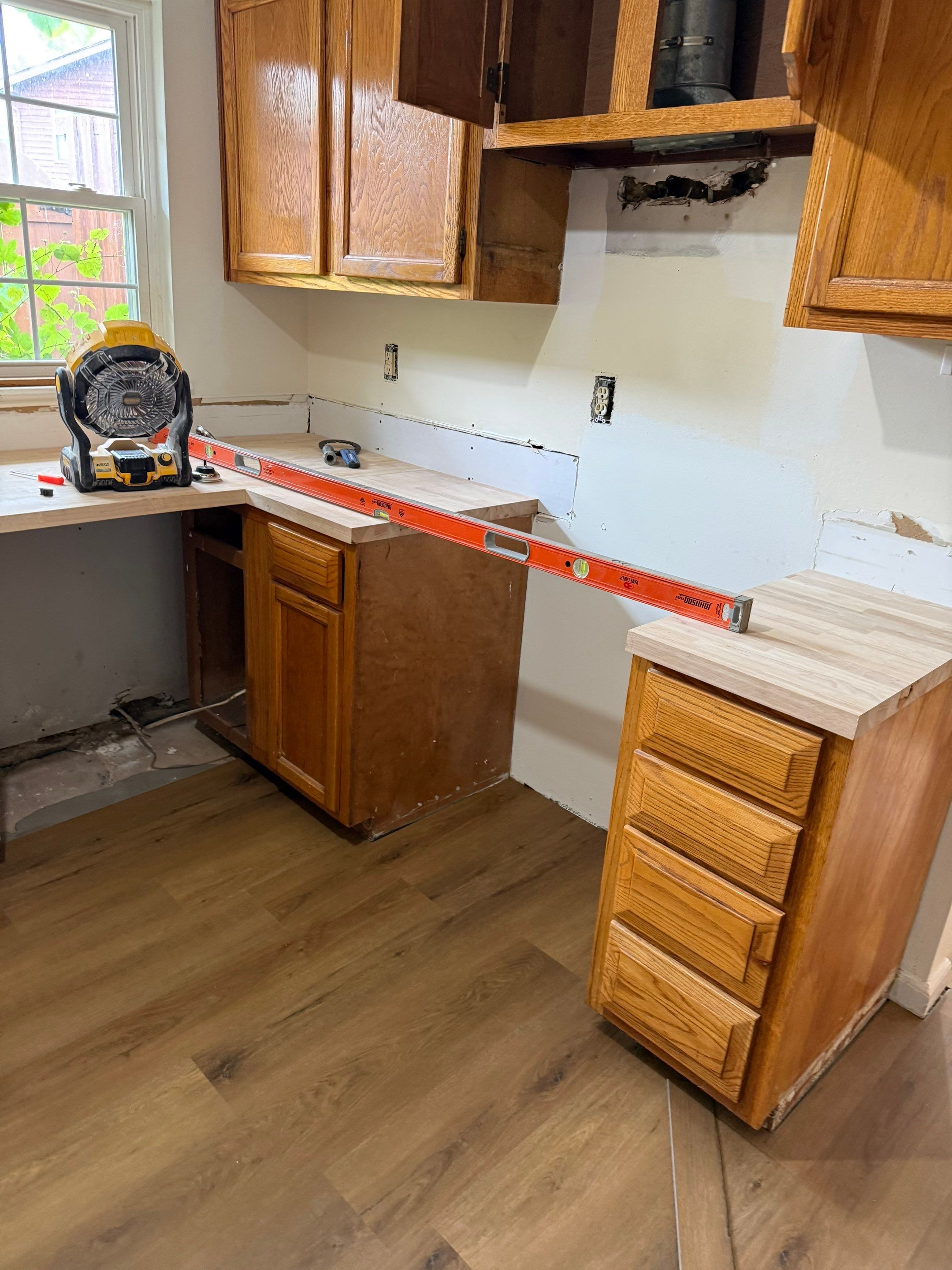 Complete Home Remodel Featuring Custom Kitchen and Wood-Look Plank Flooring by MAJO