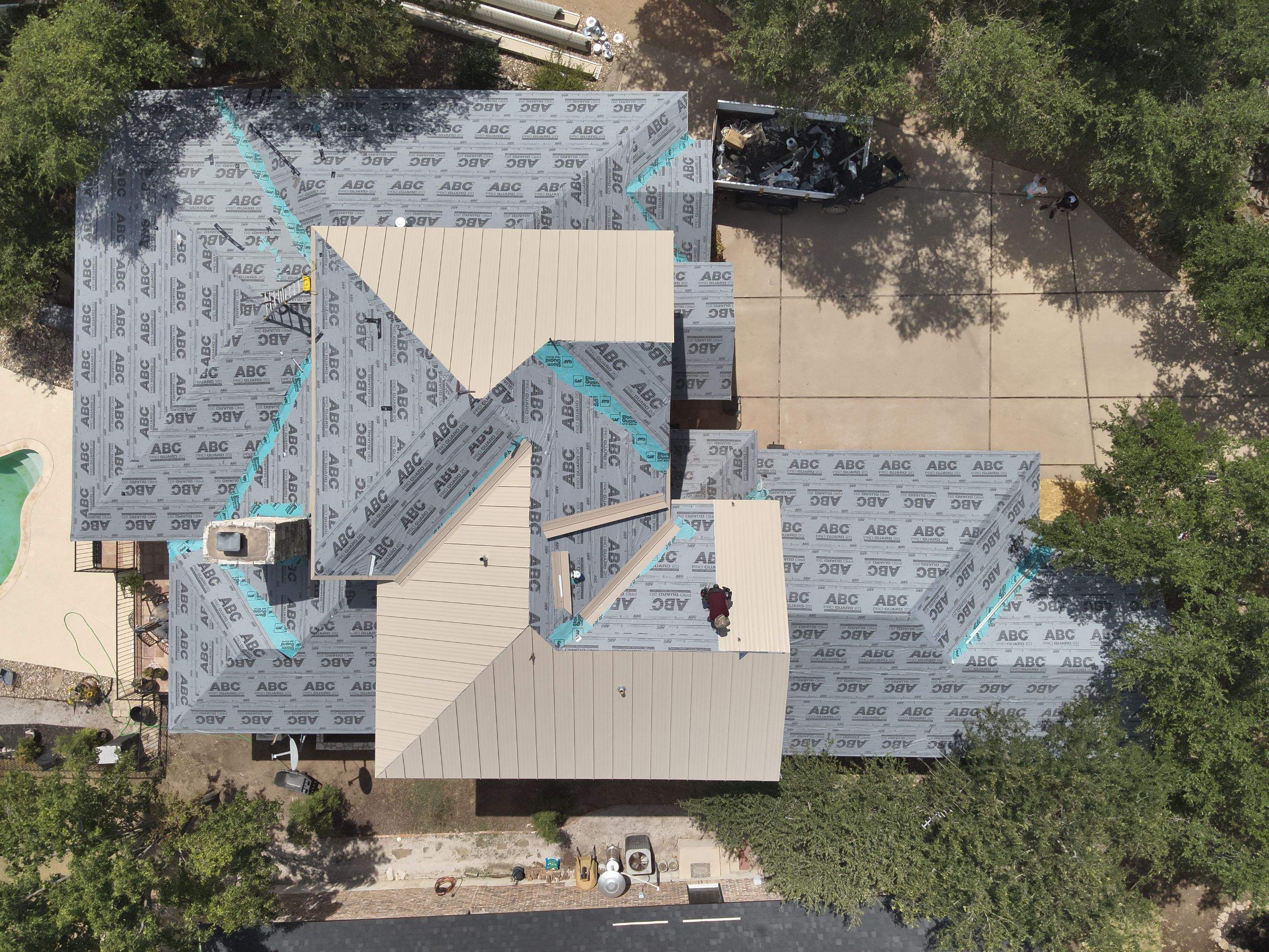 Residential Roof Replacement using 24 GA Double-Lock - Surrey Beige by Action Exteriors Austin