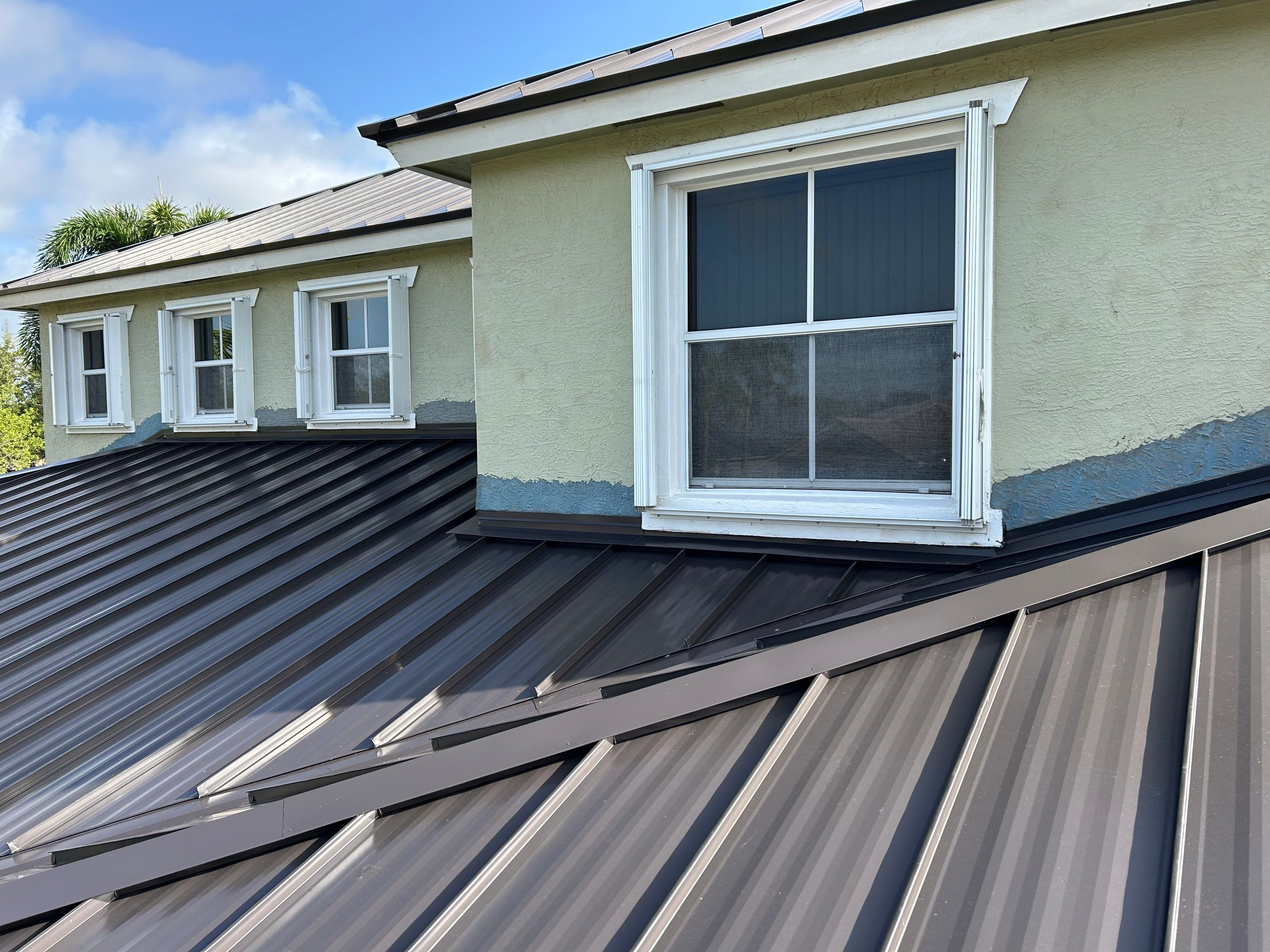 24ga 1.5" Mechanical Seam Dark Bronze by Total Roofing System The Metal Roof Experts