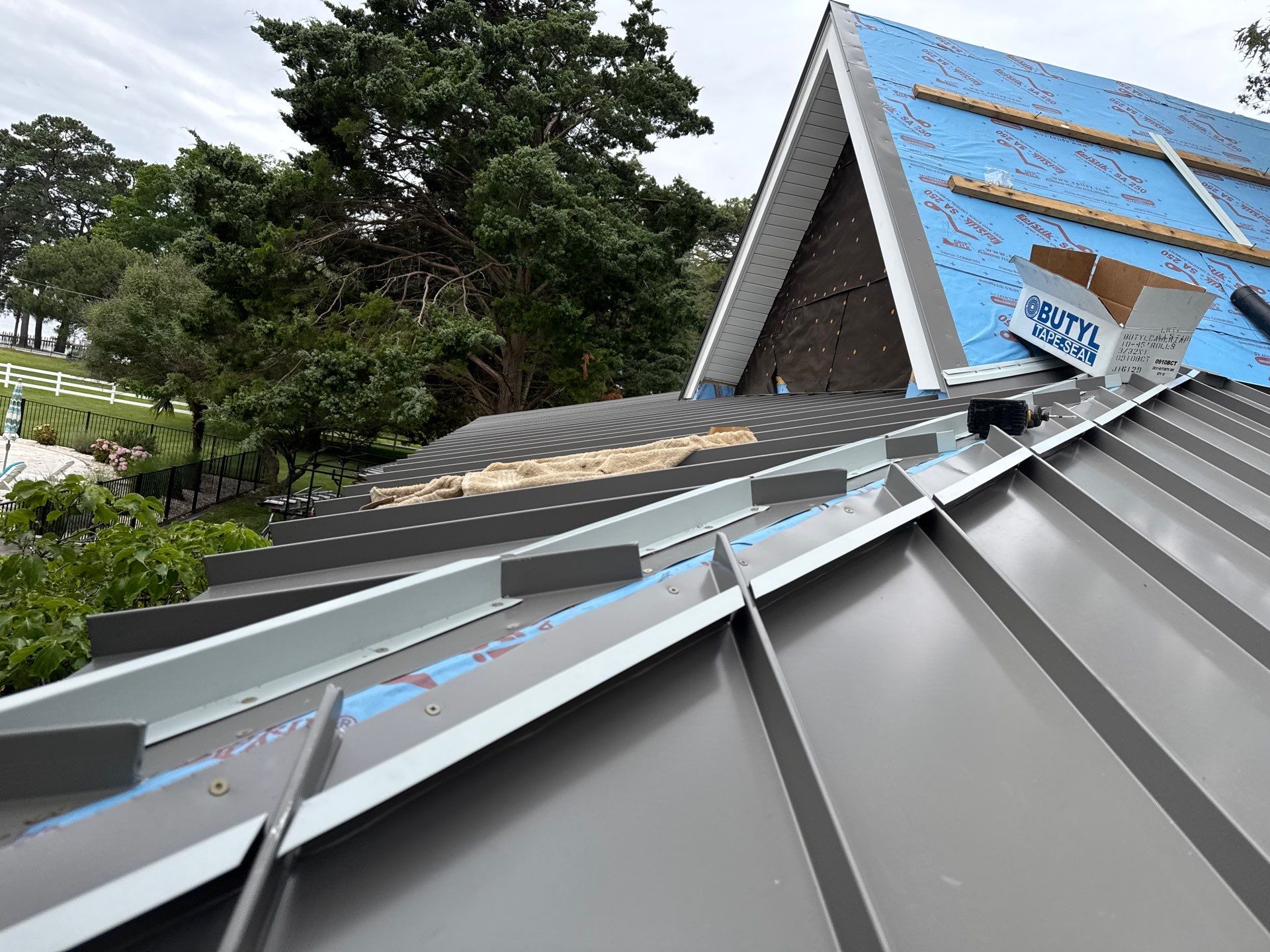 Custom New Construction Metal Roof Installation in Deltaville by Cade Construction
