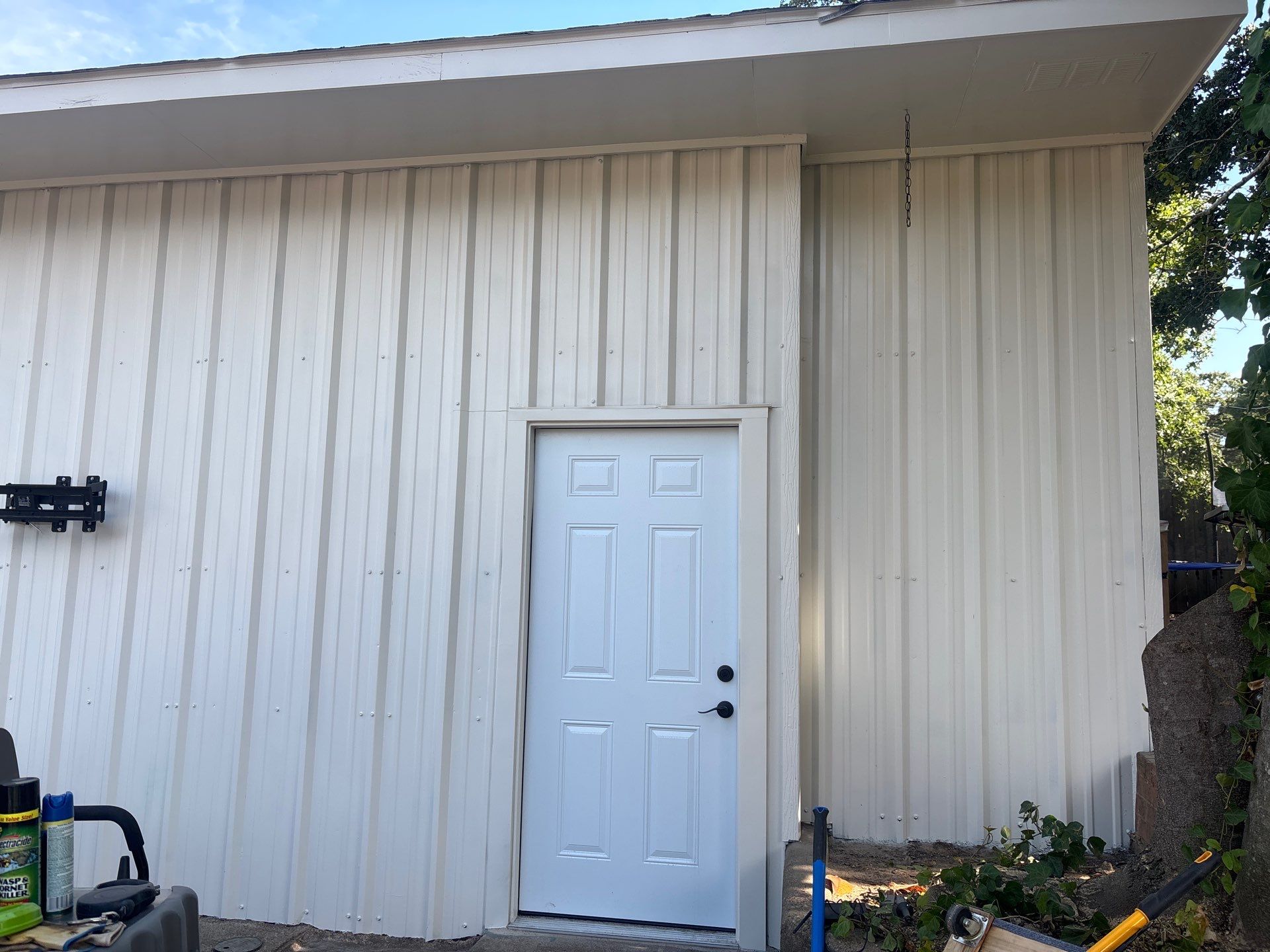 Exterior Painting in Flint, TX | White Brick Home & Metal Building with Sherwin-Williams Duration by Quality Coats Painting