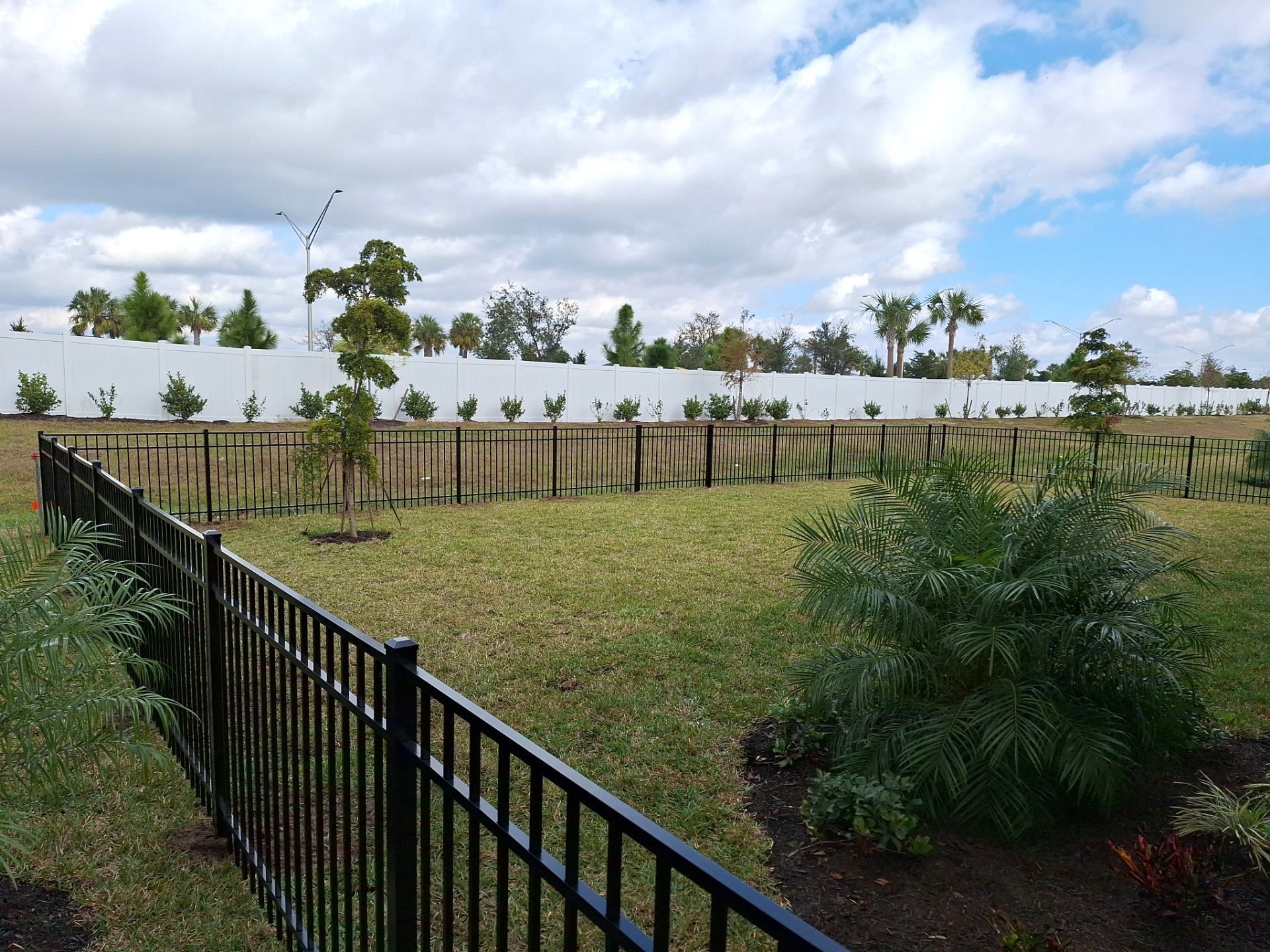 Aluminum Fence Installation using 4ft 3 Rail Black Aluminum Fence by Asap fence and gates, LLC