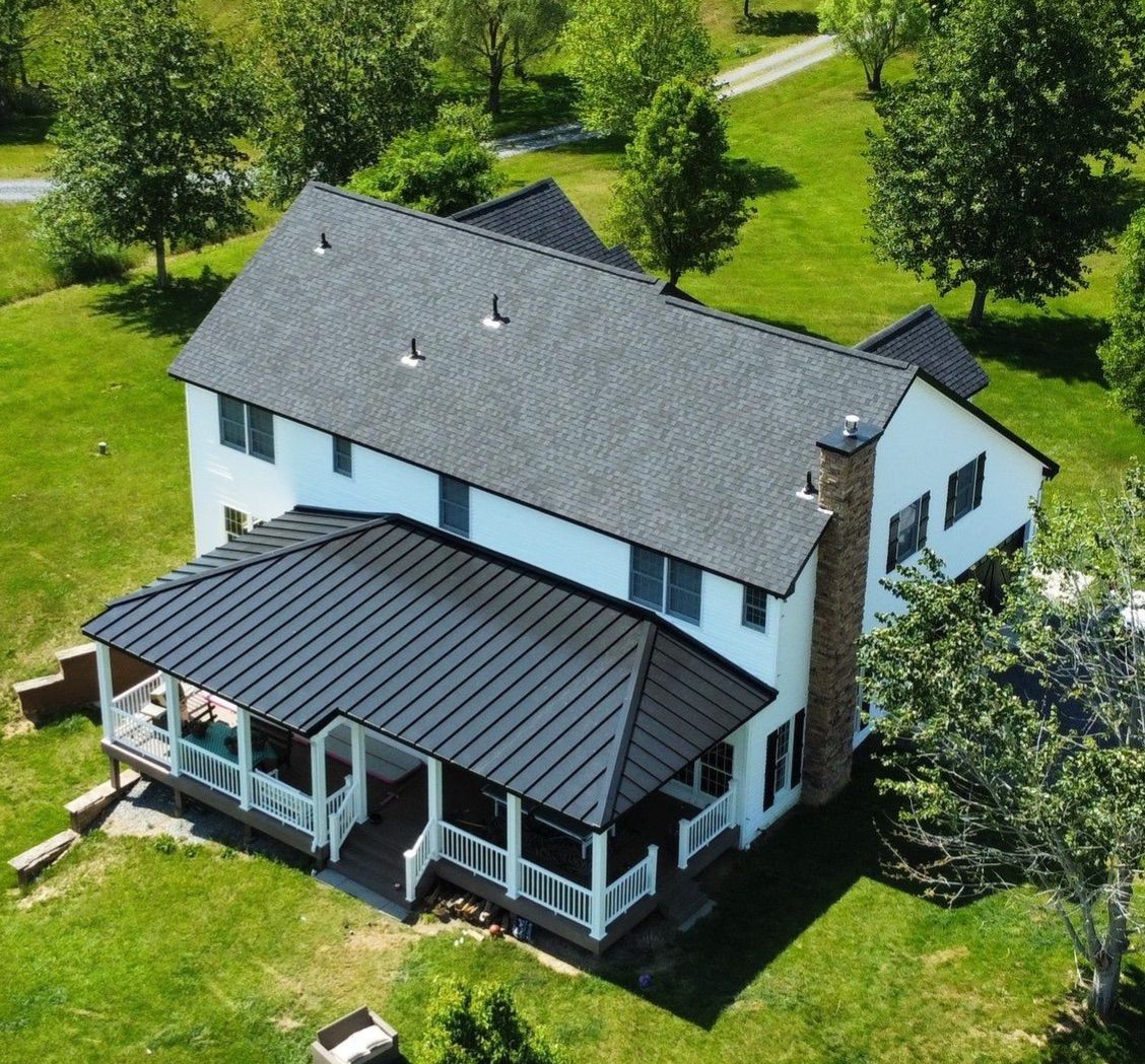 Roof Damage using Certainteed Lifetime Roofing System- Moire Black Landmark Pro shingkes with shadow ridge caps. by BulletpROOF Exteriors