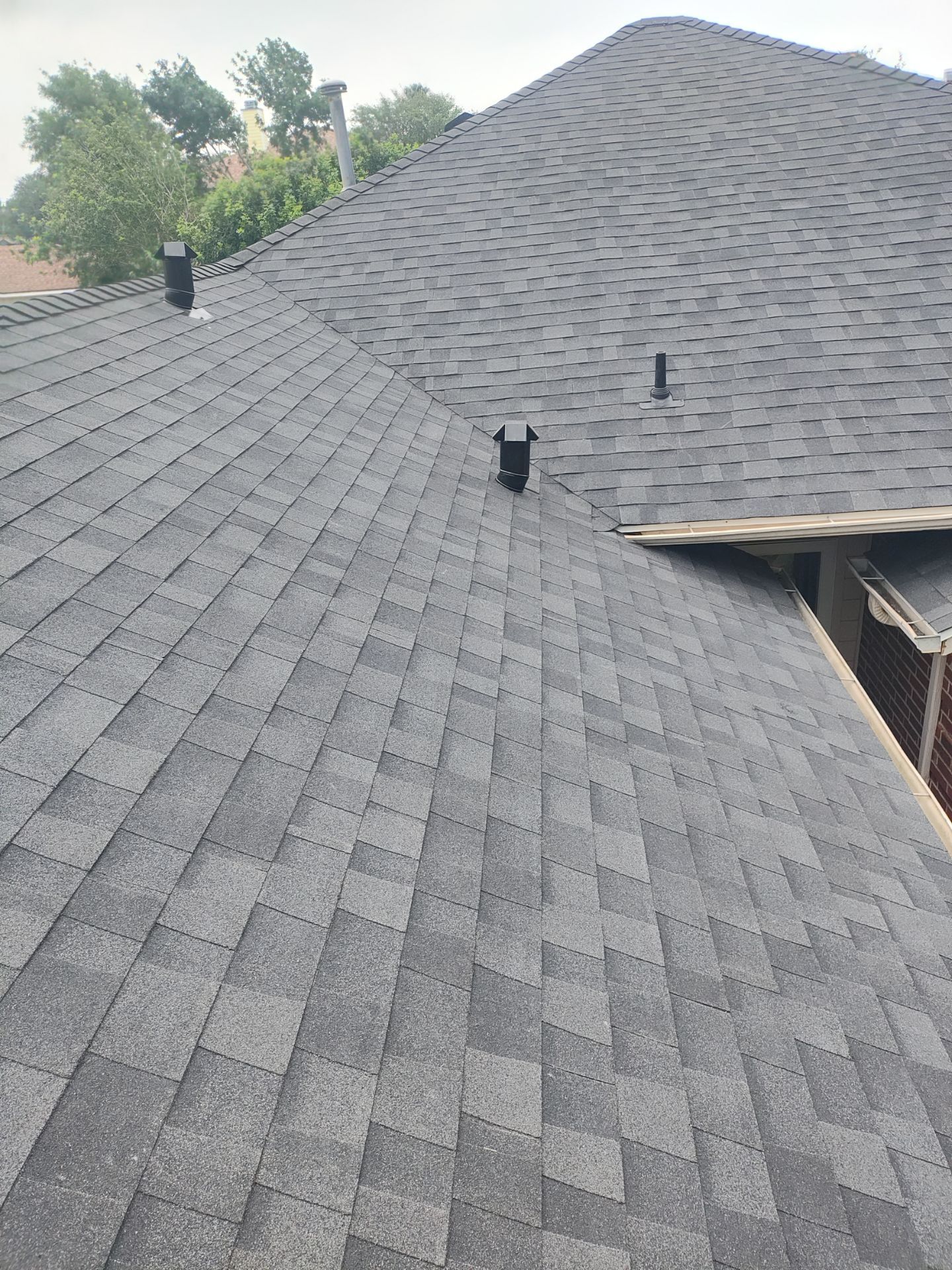 Nothing looks nicer than a little black roof by Bayfront Roofing and Construction