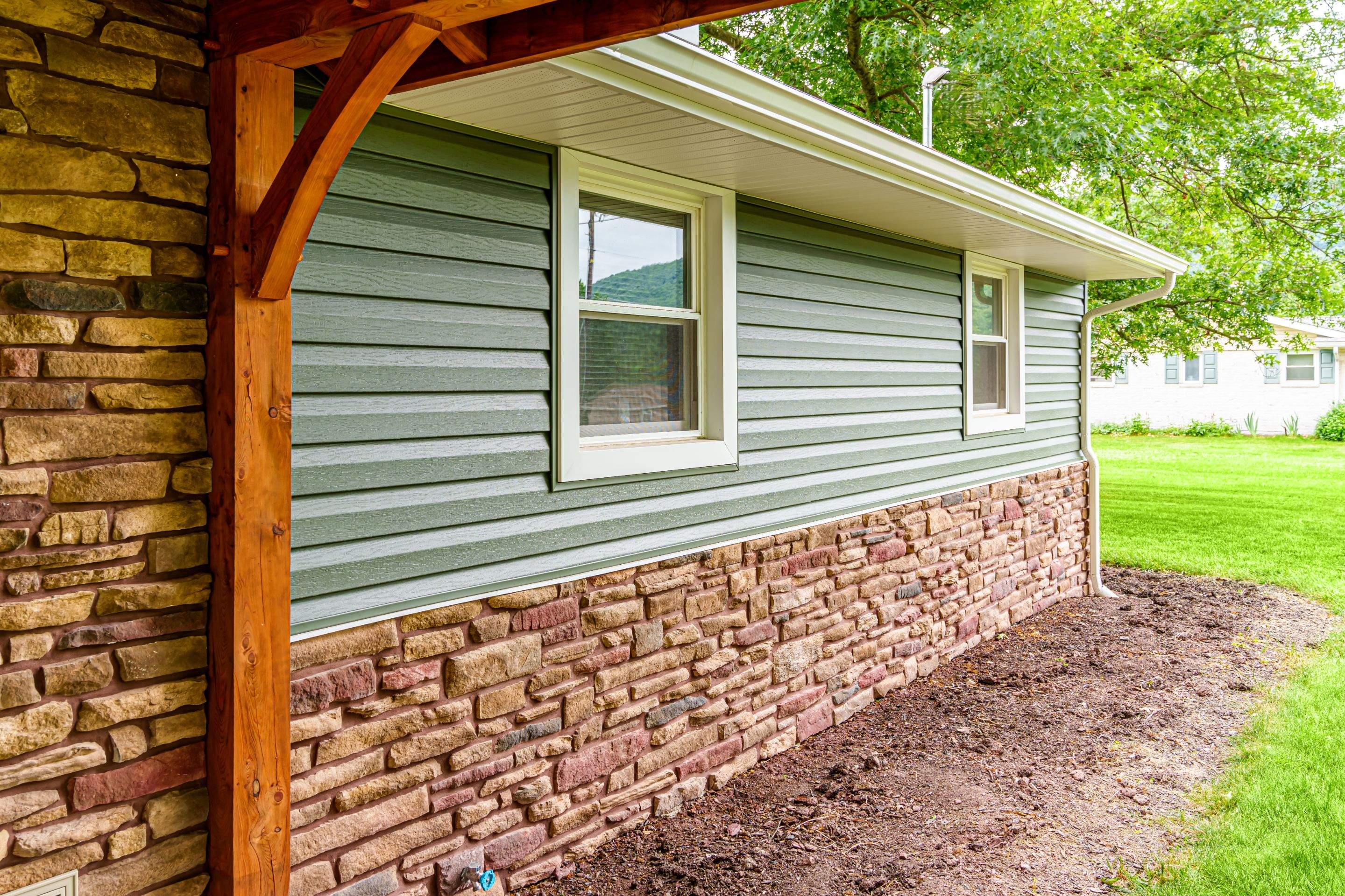 Shingle Roof- new siding- entry door by Esh Builders