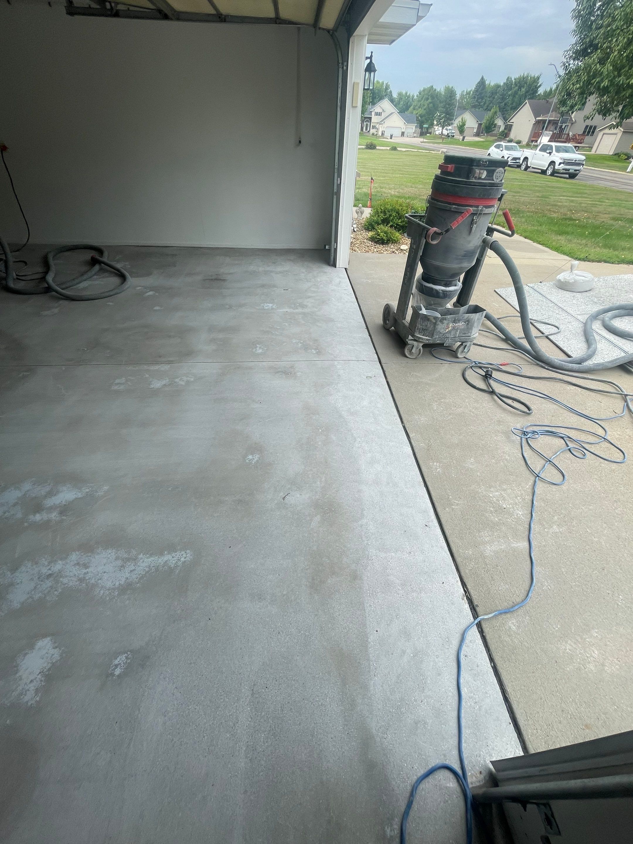 Coyote Flake Garage Floor Coating in Worthington, Minnesota by Select Painting, Coatings & Garage Cabinets