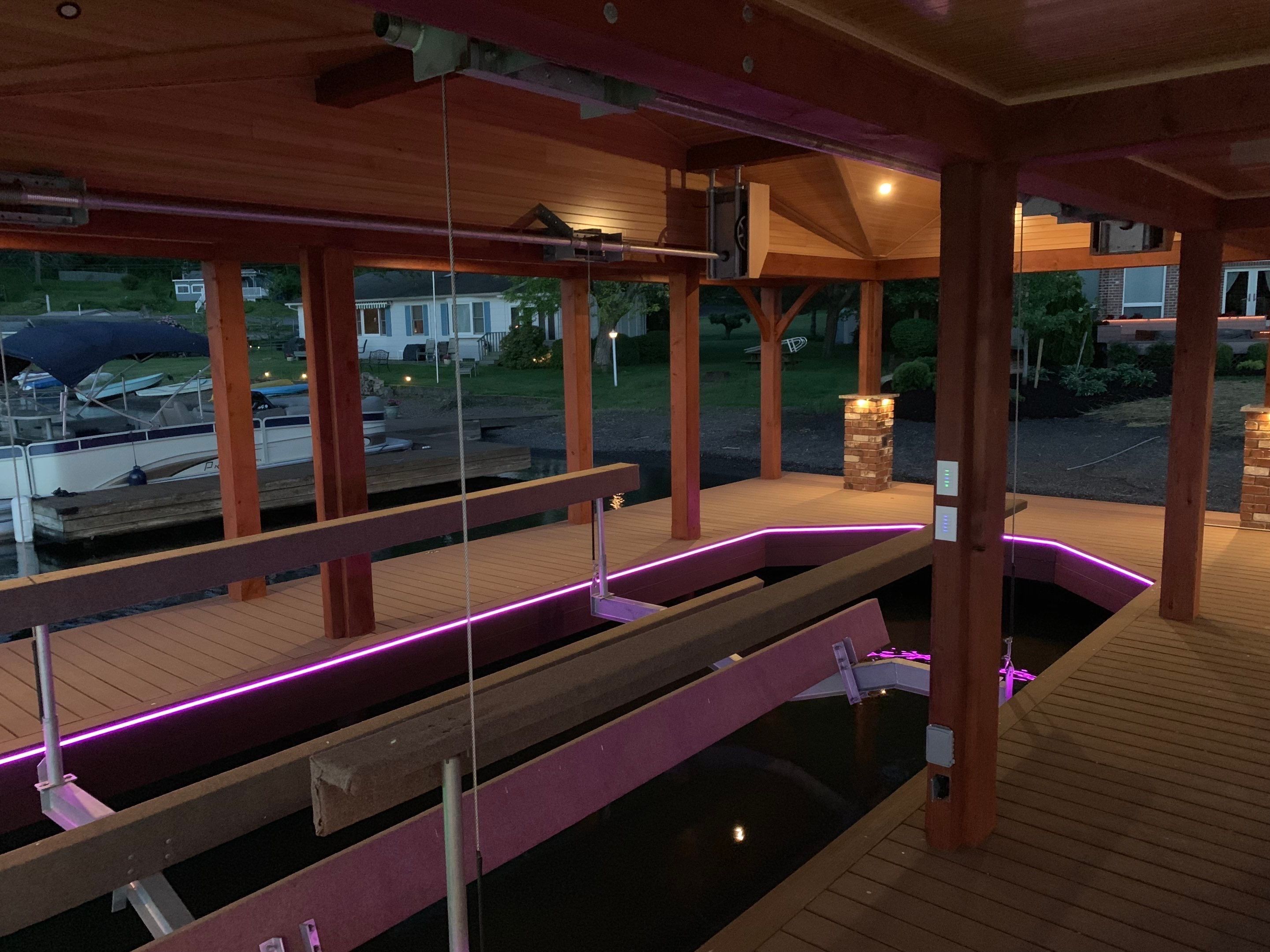 Custom Timber-Framed Boat Dock with Multi-Color LED Lighting on Keuka Lake, New York by Outdoor Lights + Shades