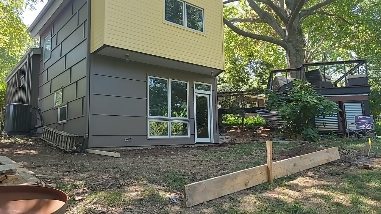 Back Yard Cantilivered Patio by LAND ESCAPES LLC
