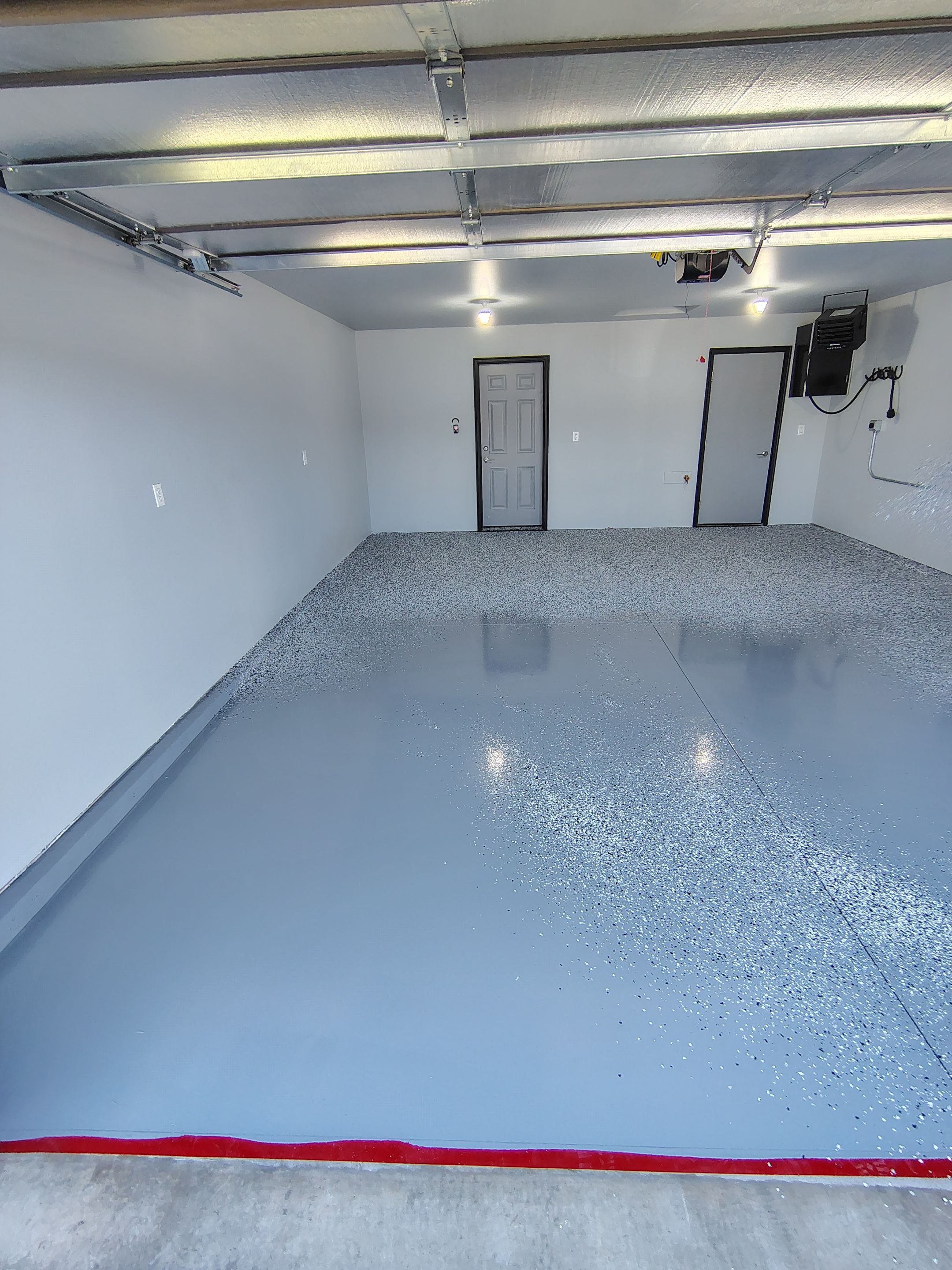 Custom Epoxy Garage Floor Coating Installation in Sioux Falls by Select Painting, Coatings & Garage Cabinets
