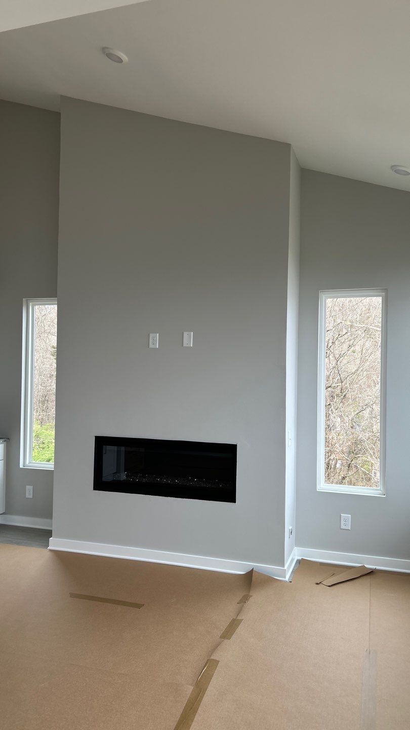 Floor to Ceiling Fireplace Surround by Footprints Floors of Nashville