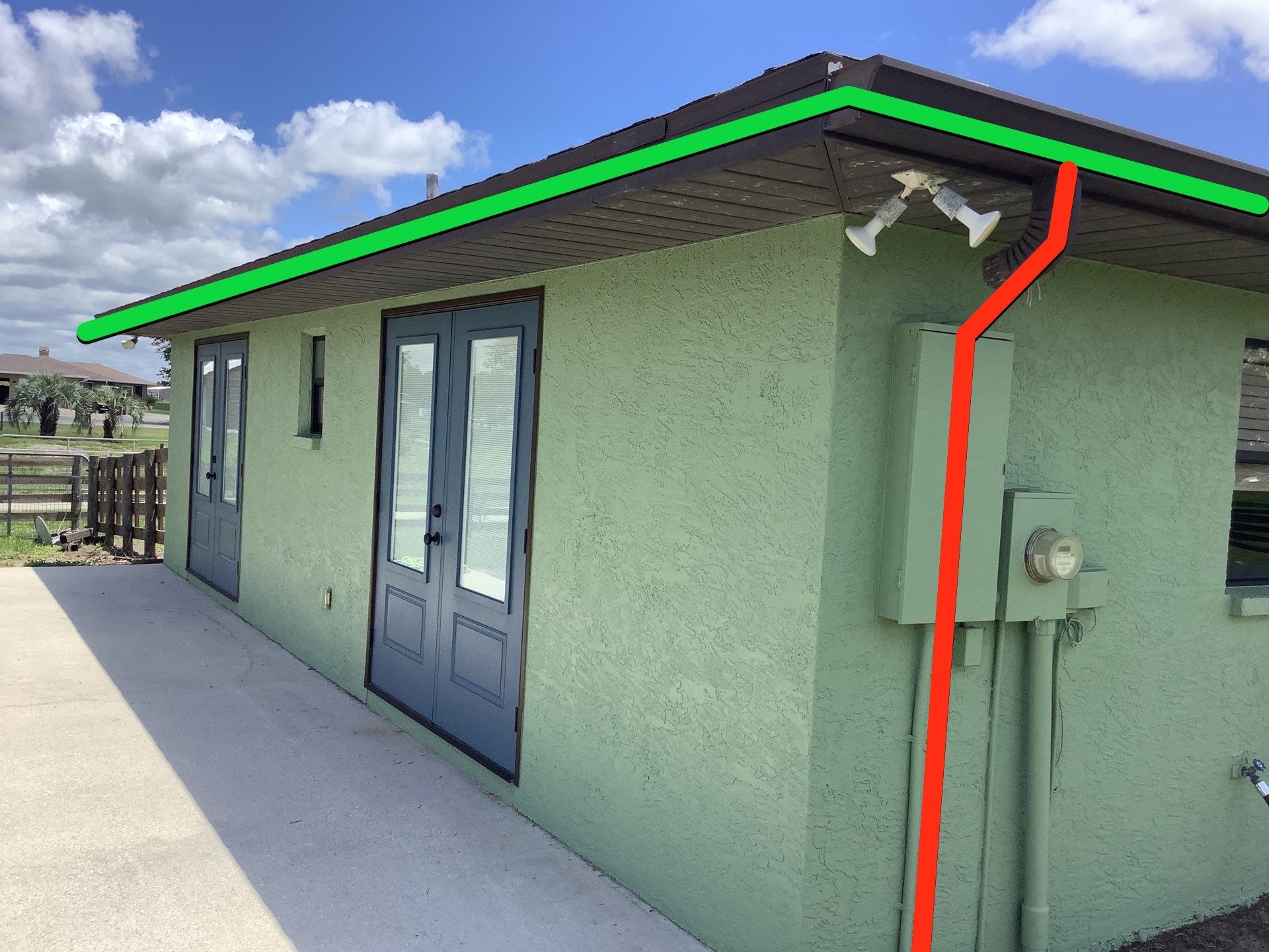 Musket brown downspouts with 6-inch K-Style gutter installation in Myakka City, FL by Gutter Professors