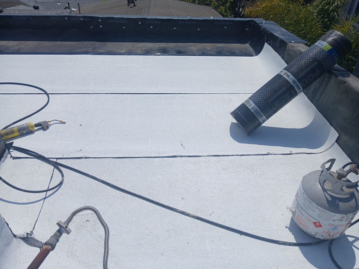 Residential Roofing Installation using Polyglass Torch Down Roofing System by Hull Brothers Roofing