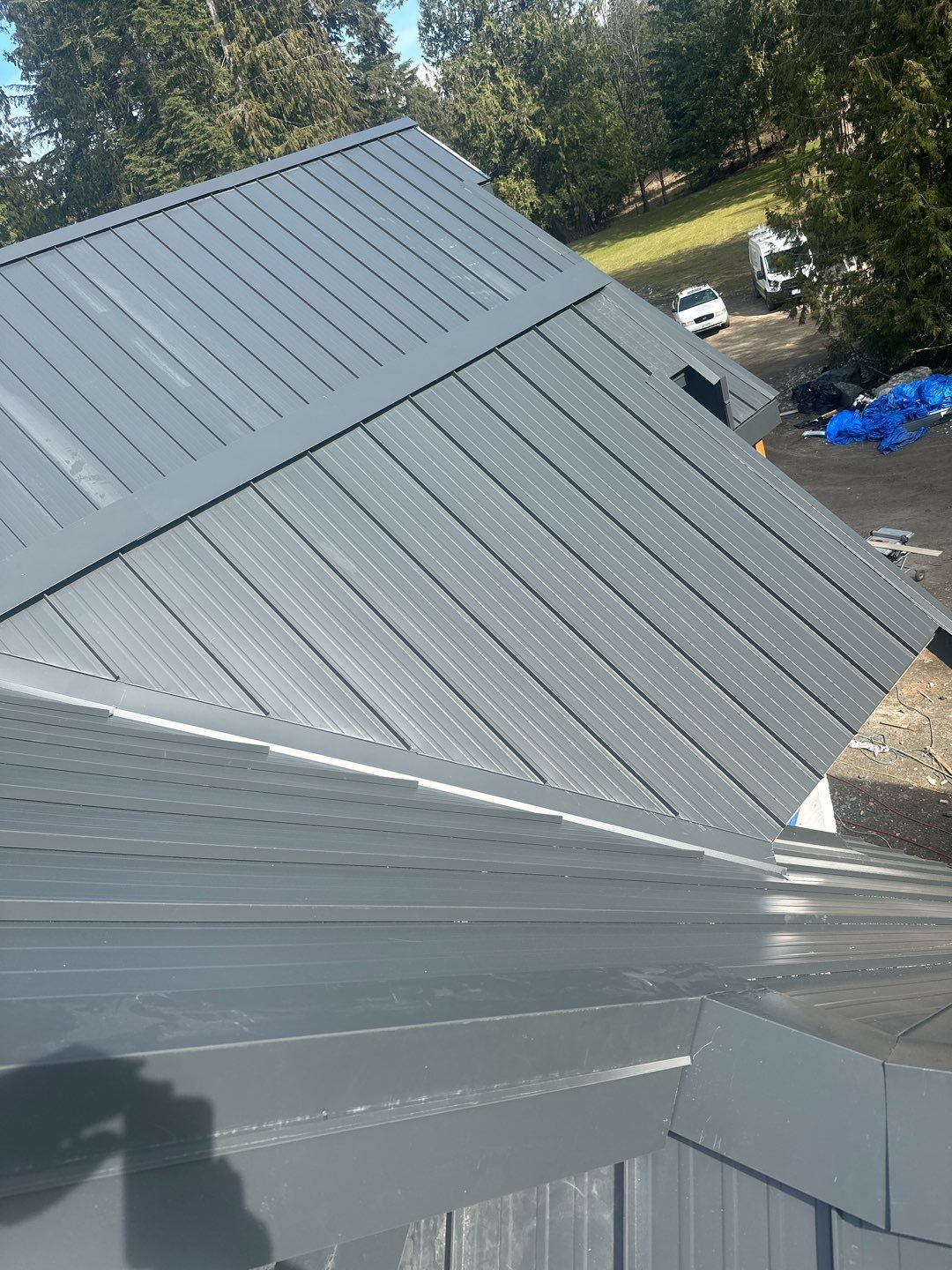 Residential Roofing Installation using 12" Prolok metal by Top Notch Roofing Inc