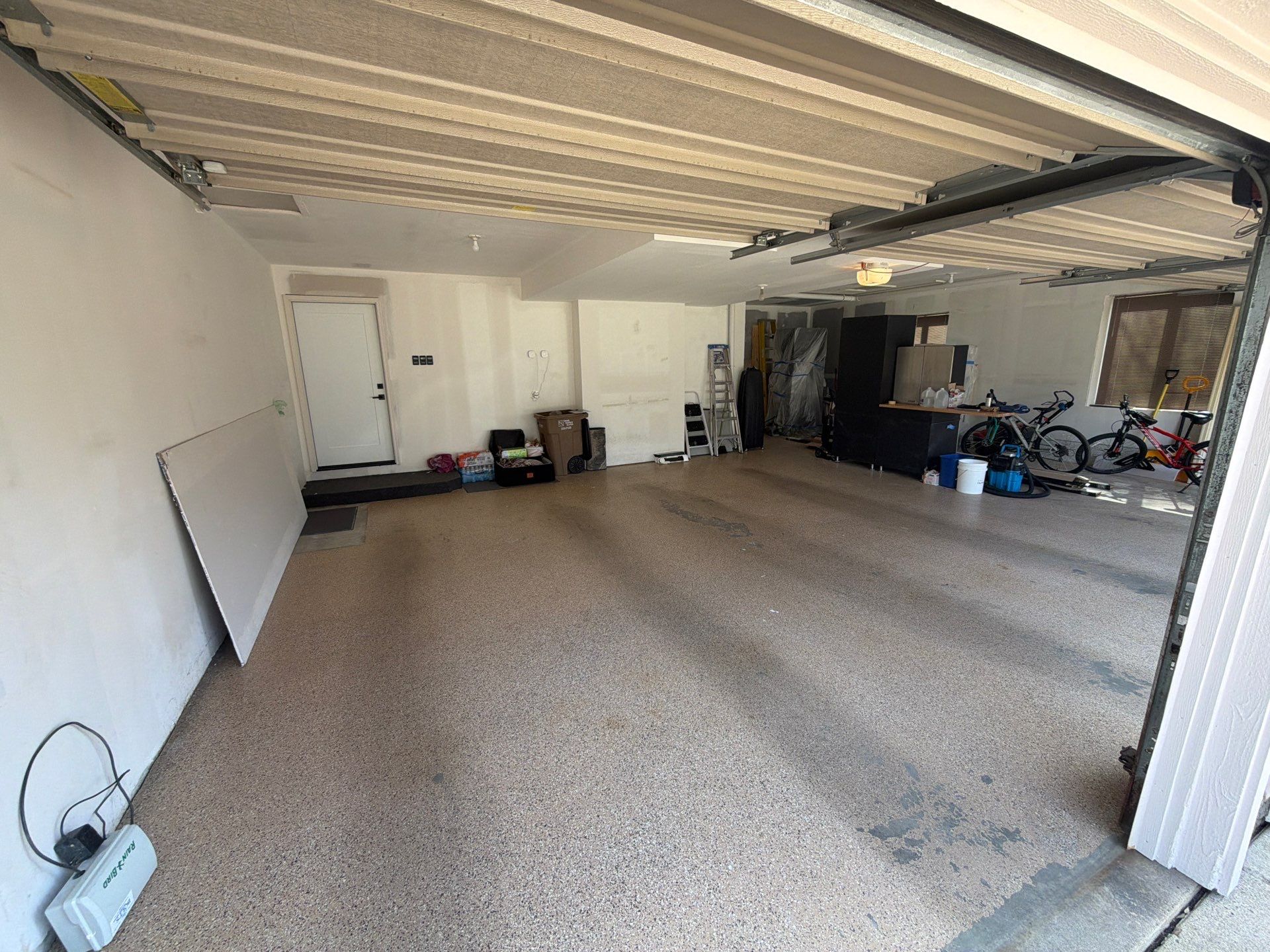Gray Speckled Epoxy Garage Floor Coating in Sioux Falls by Select Painting, Coatings & Garage Cabinets