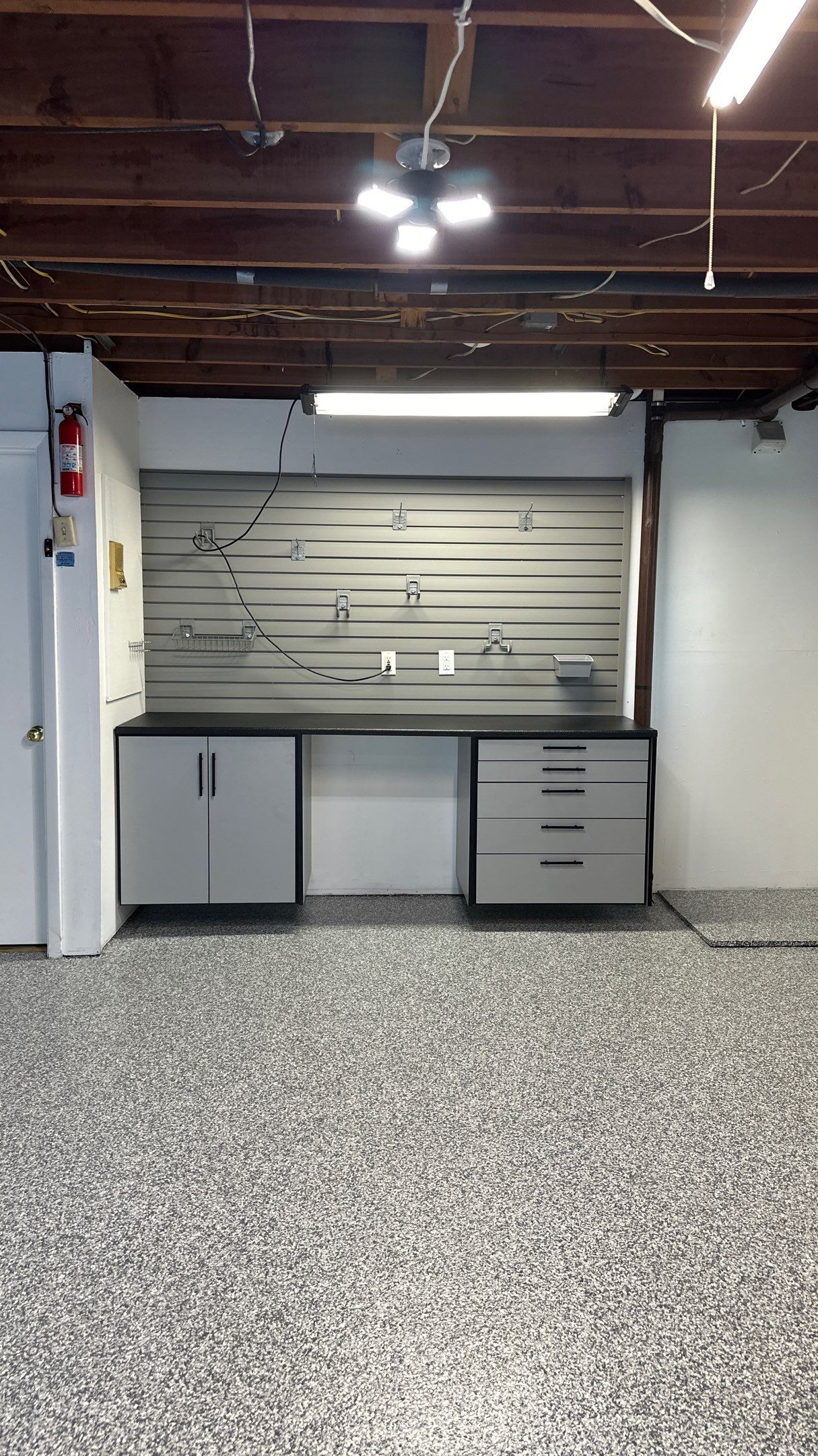 Vernon T. new garage floor and storage looks great!! by Banner Garage