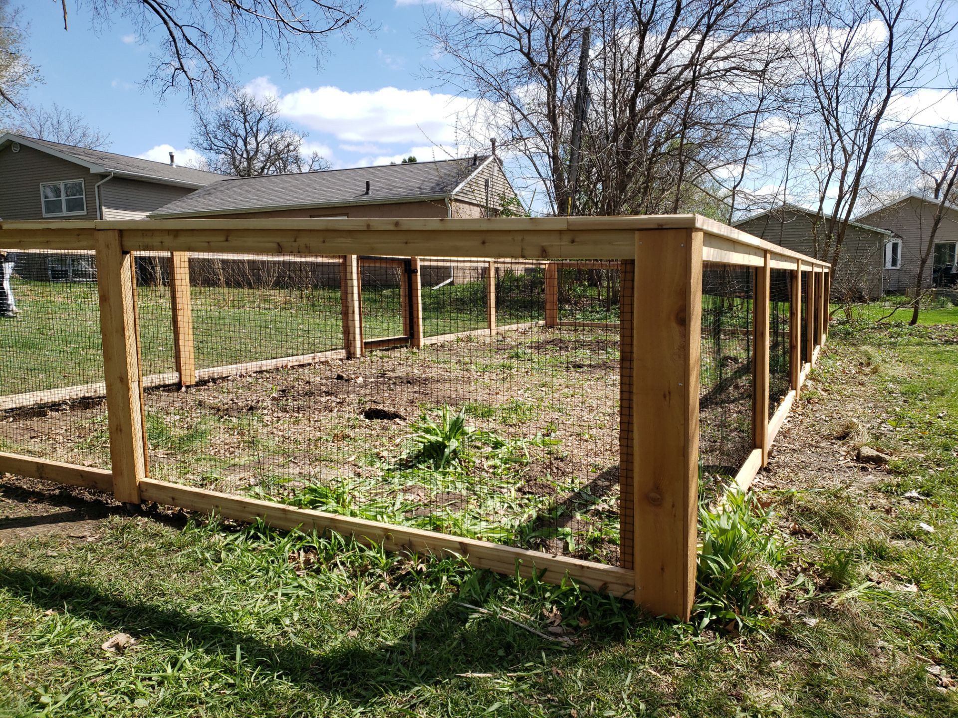 Custom Cedar Wood Garden Fence Installation in Cedar Falls by Perfect Picket Fence and Stain