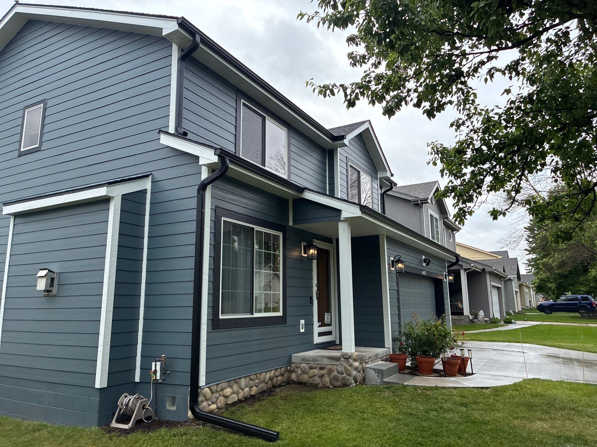 James Hardie Siding and Window Replacement with Arctic White Trim by Carps Complete Exteriors