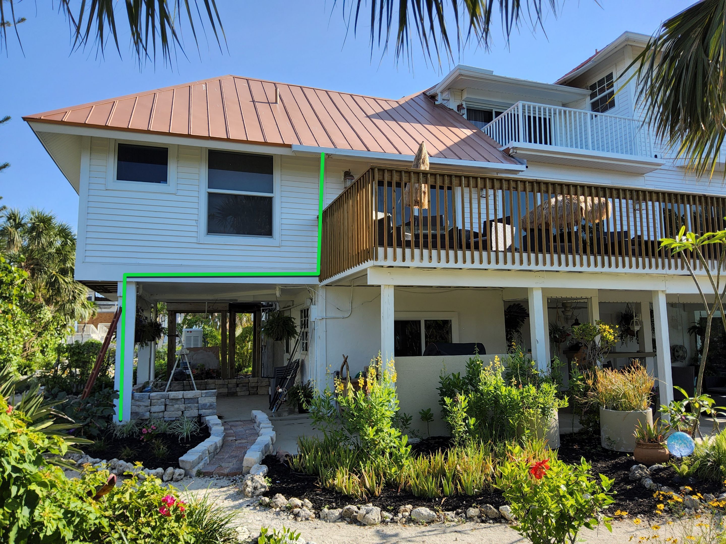 White K-Style Gutters Installed with White Downspouts in Sanibel FL by Gutter Professors