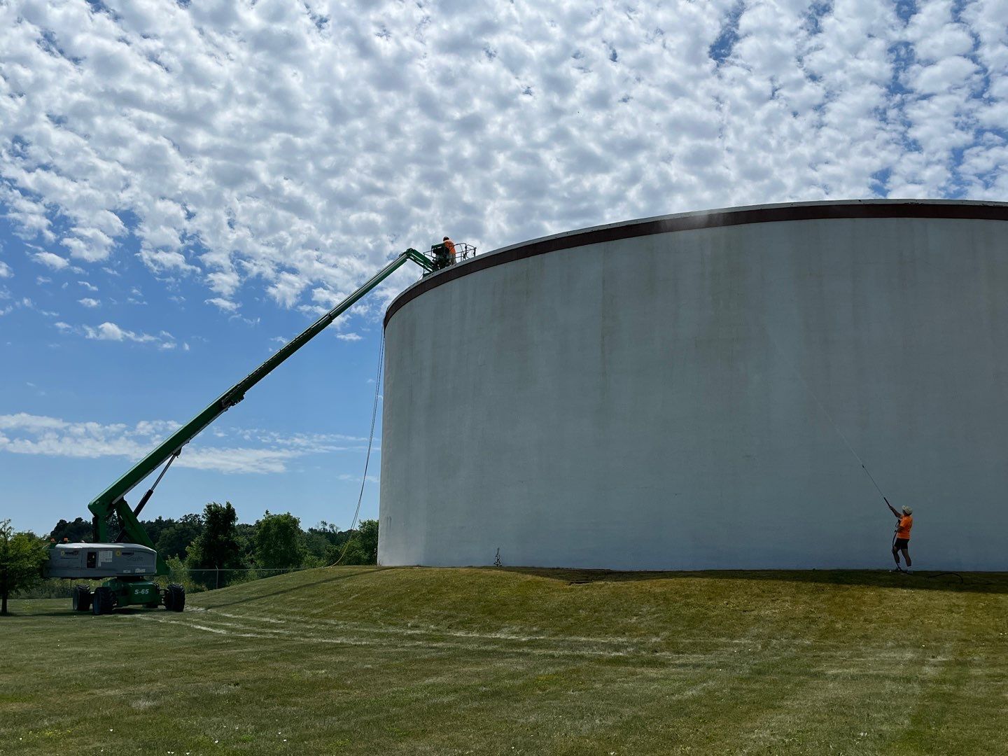 Water tank cleaning by Northern Power Washing LLC.