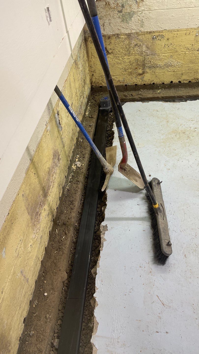 Interior Waterproofing Using GrateDrain™ Products by Toledo Basement Repair 
