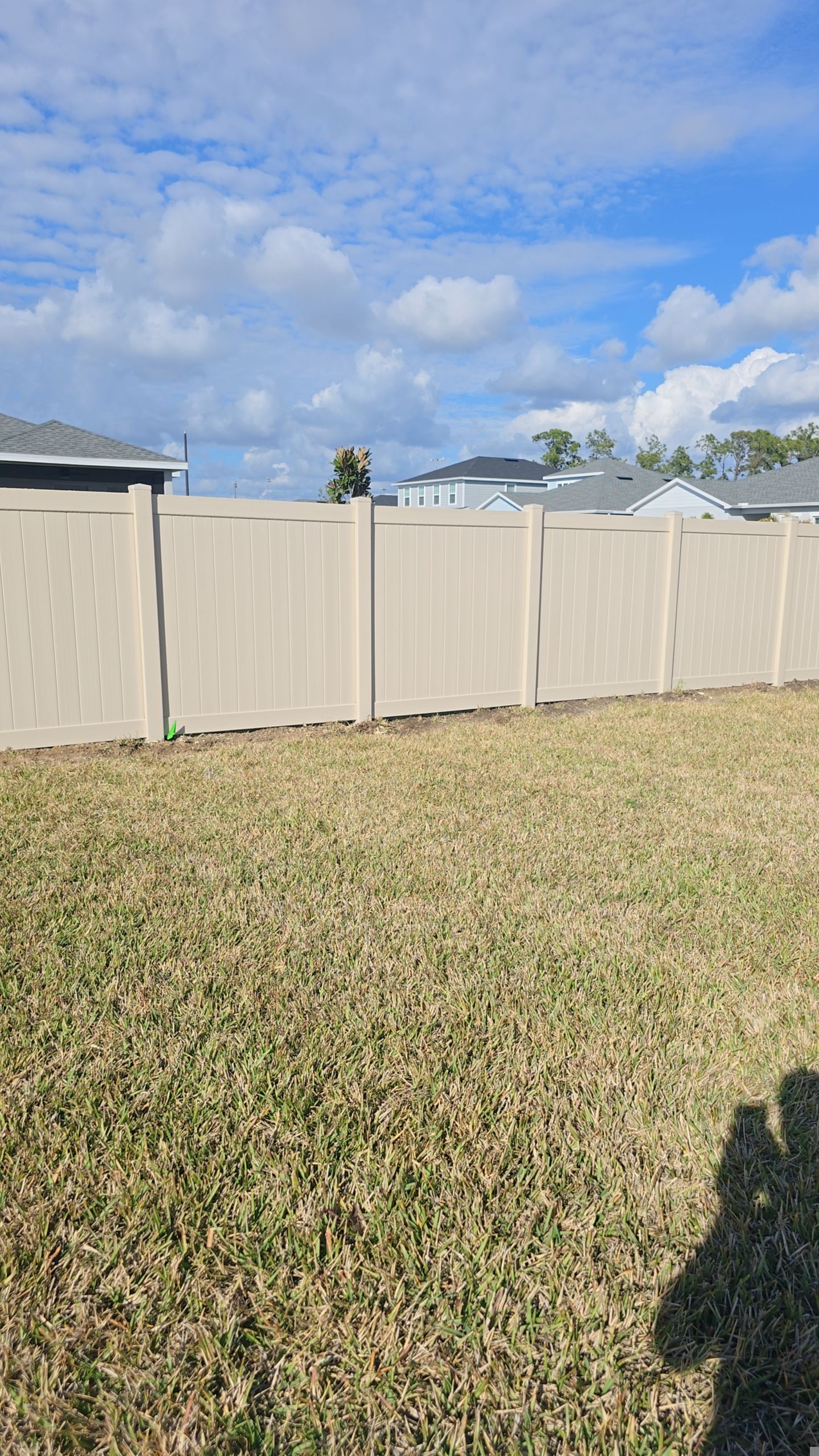 Tan Vinyl Fence in West Port by True Fence LLC