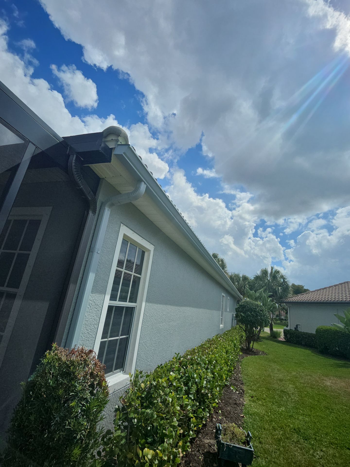 6-inch K-style Seamless Gutters and Splash Guard in Grey Color in Naples FL by Gutter Professors