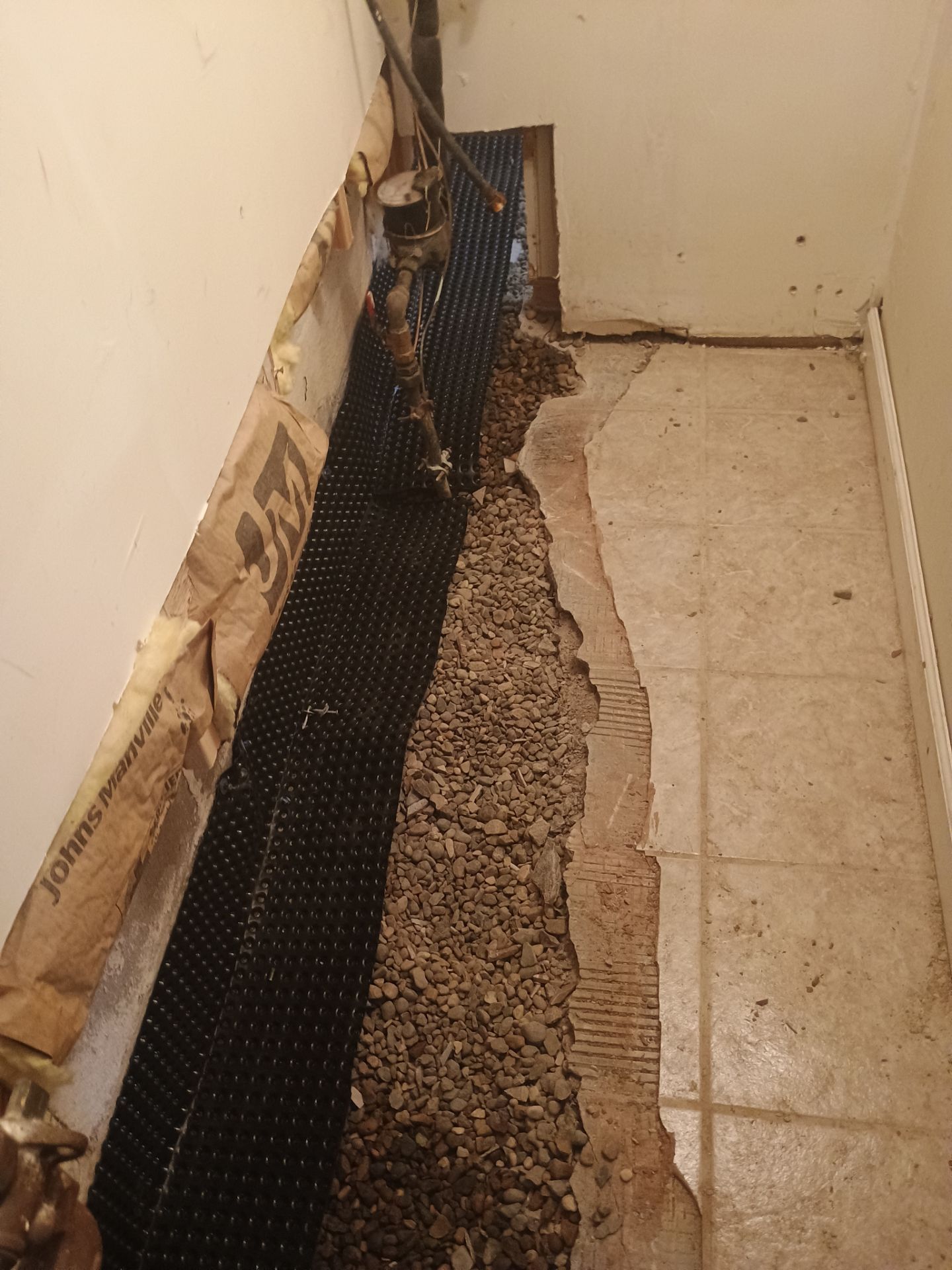 Drain Tile in Minneapolis for Kristen & Taylor by Waterproofing Northeast