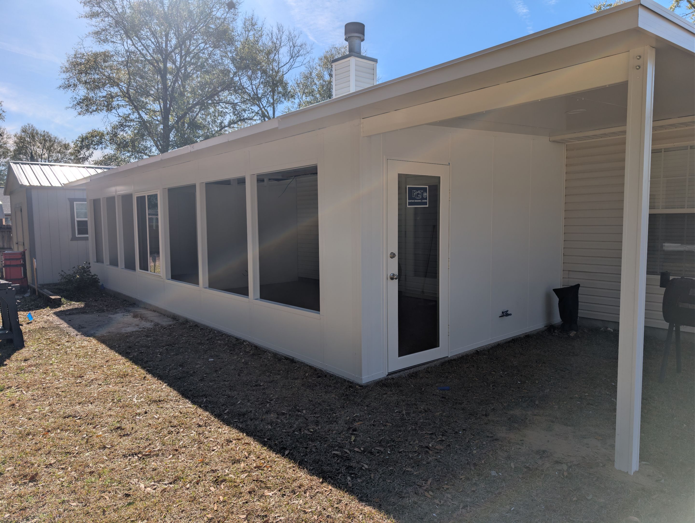 Large Divided Glass Room with Patio cover by Titan Sunrooms