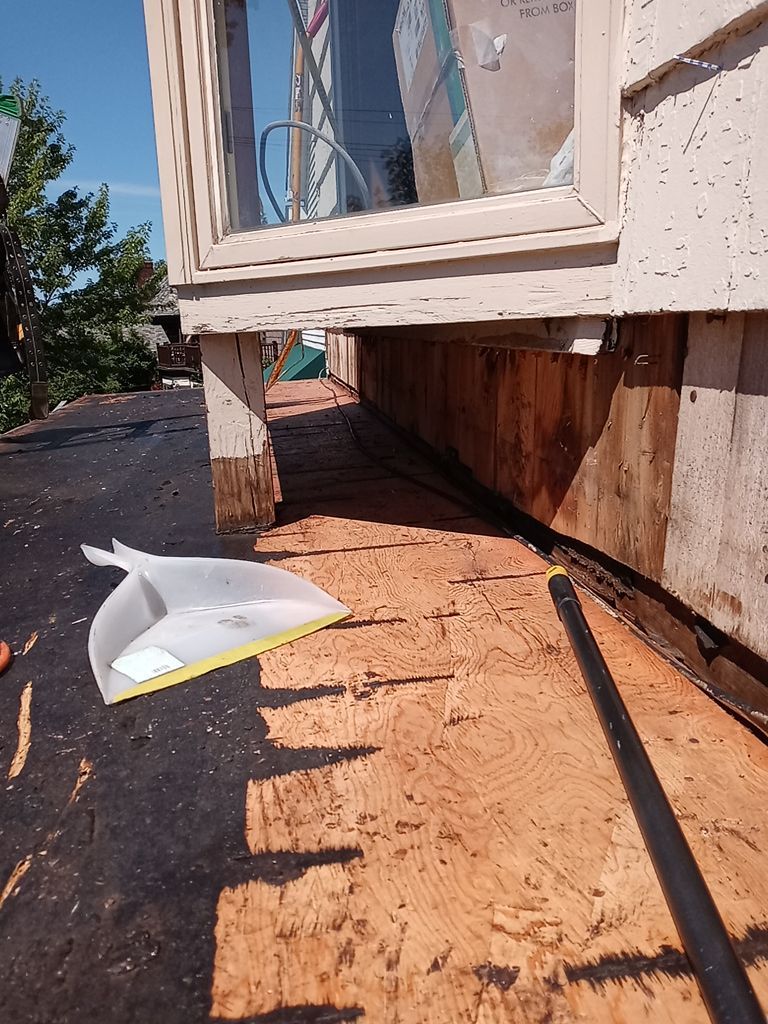 Residential Roofing Installation, Dec-tek walk-out porch roof, siding on garage by Absolute Roofing and Construction