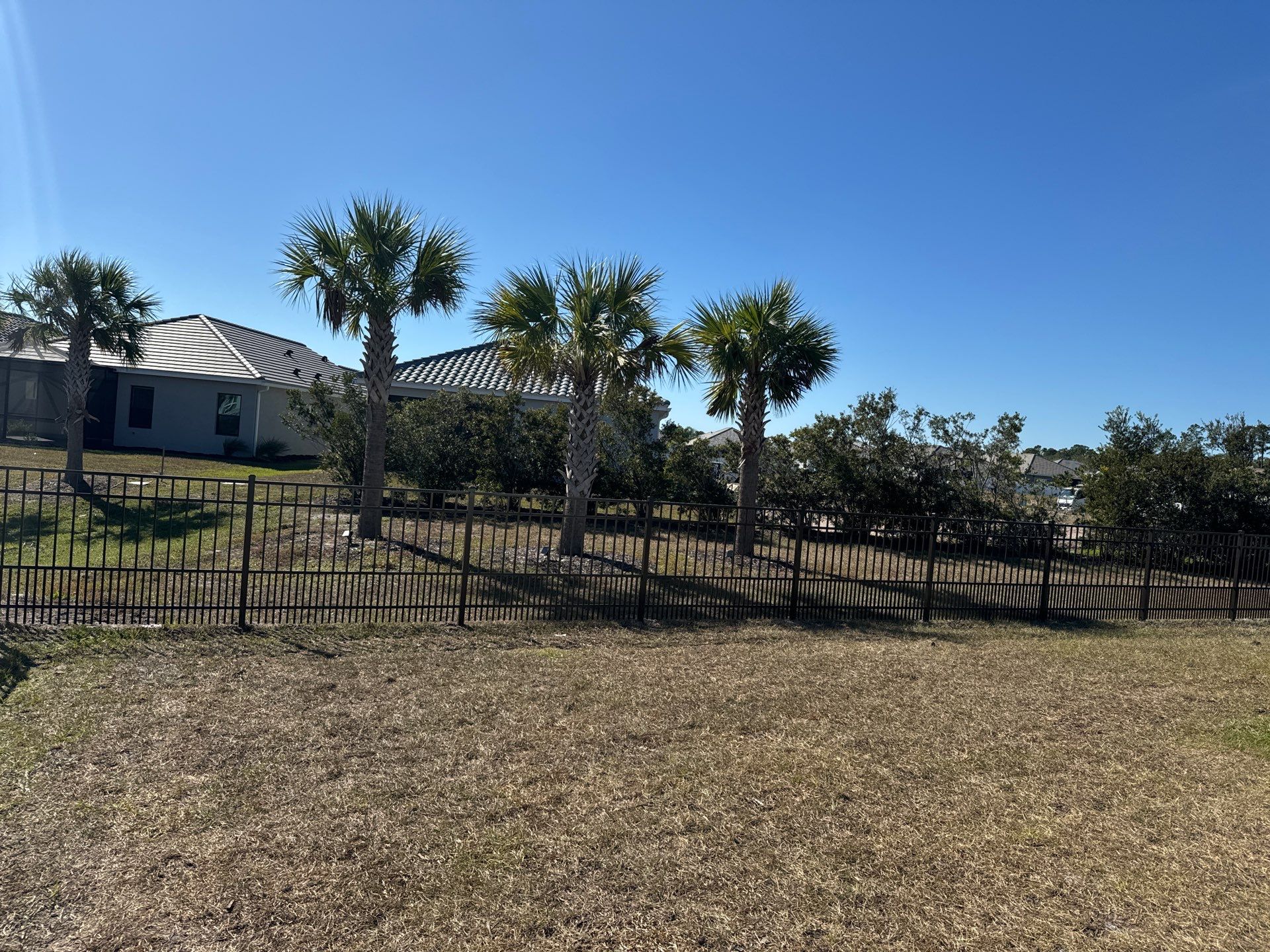 Aluminum Fence Installation using 4Ft 3 Rail Bronze Puppy Picket Aluminum Fence by Asap fence and gates, LLC