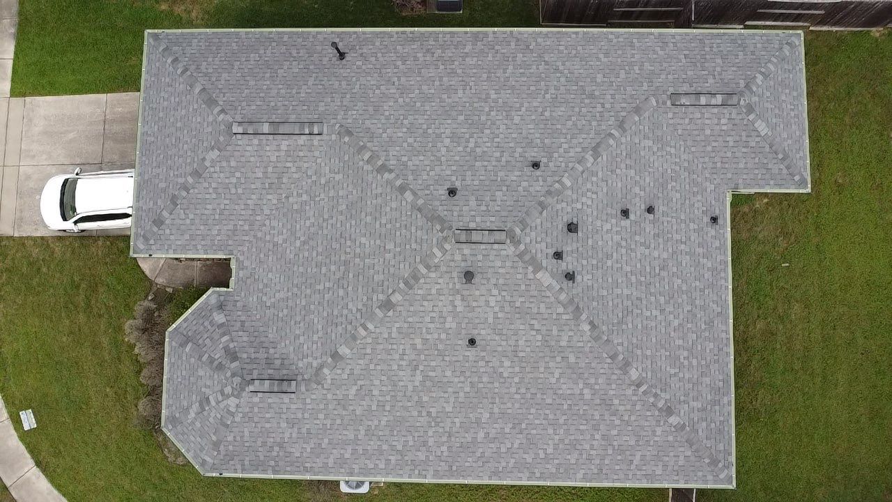 Reroof and Gutter Project in Houston by Roofing Technologies Unlimited