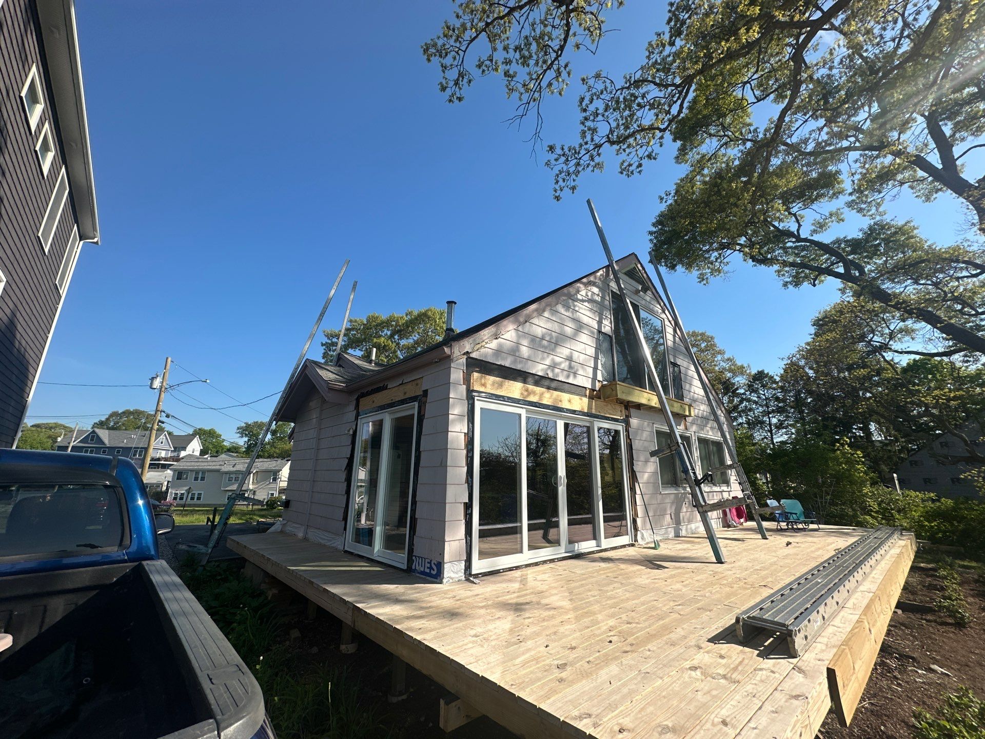 Milford Exterior Renovation Featuring Custom Siding and Wood Deck Installation by A Plus Exterior