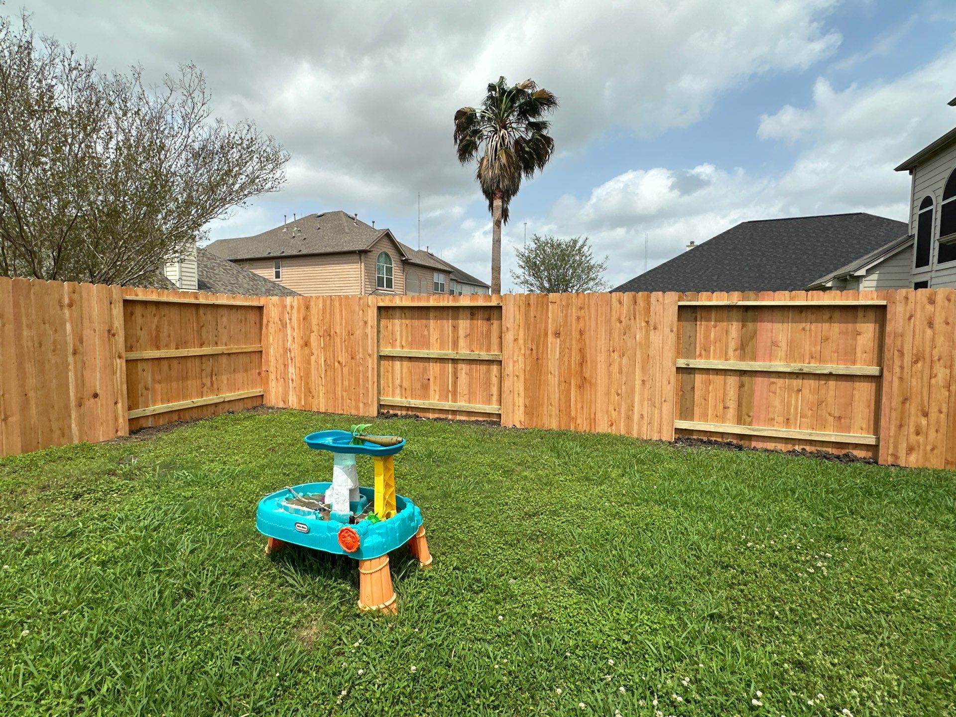 Wood fence with alternating panels by Tim's Fences